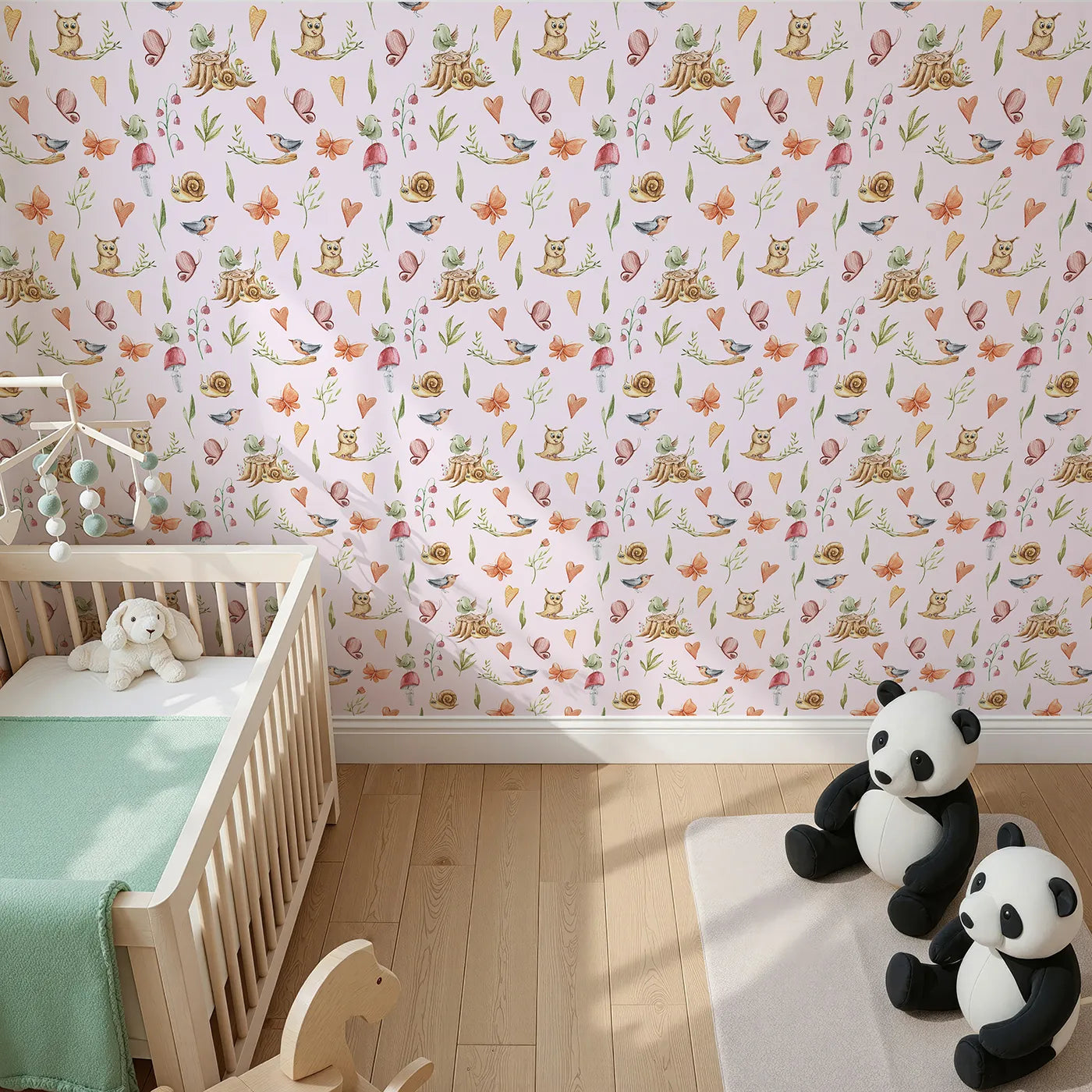 Top-Down view of Whimsy Tots' Woodland Playtime Parade Wallpaper in Blush Pink (W3257B).Owls, birds, butterflies, and snails gather for a joyful woodland stroll.