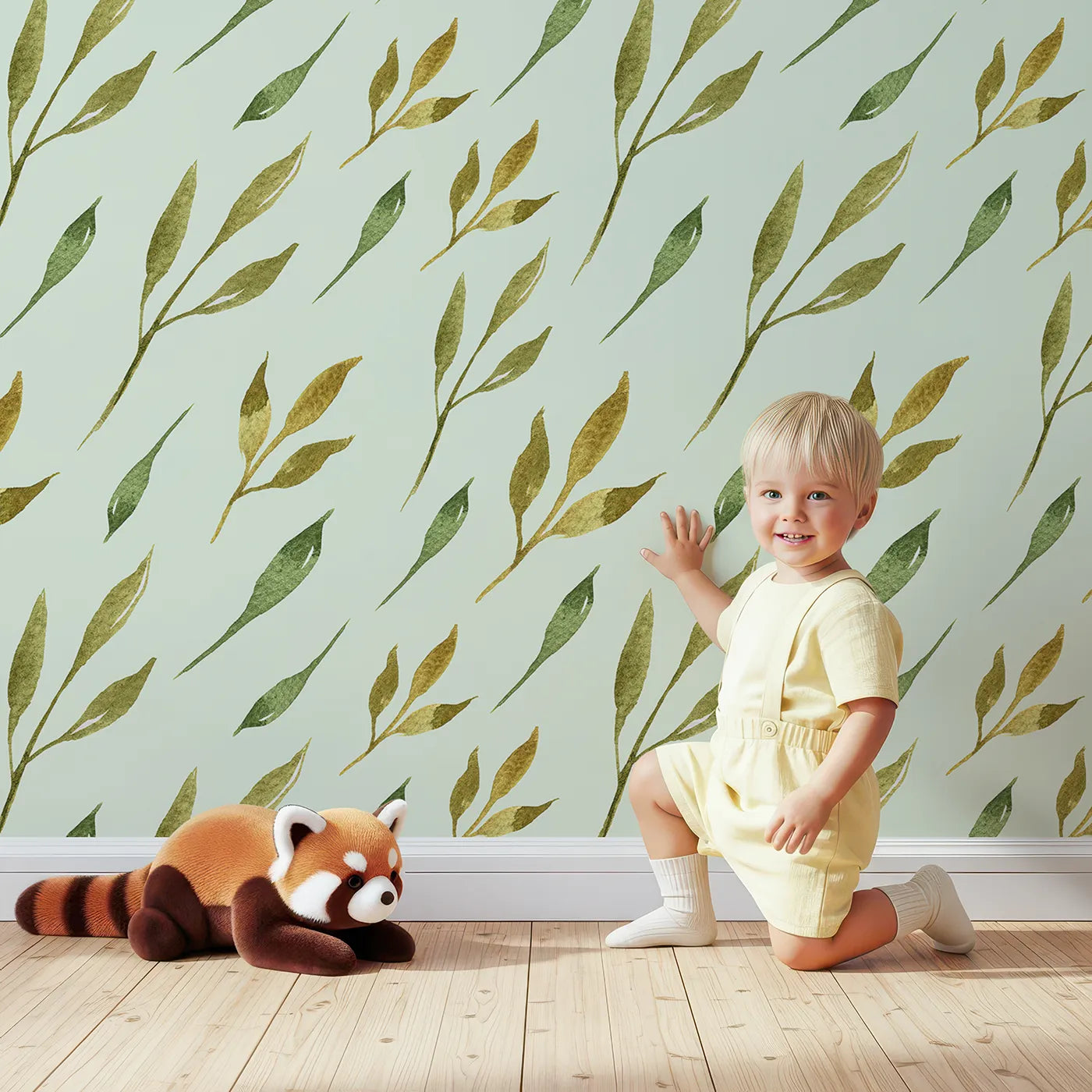 Lovely child standing in front of Whimsy Tots Wandering Willow Sprigs Wallpaper in Mint Green with leaf, sprig, branch in design.