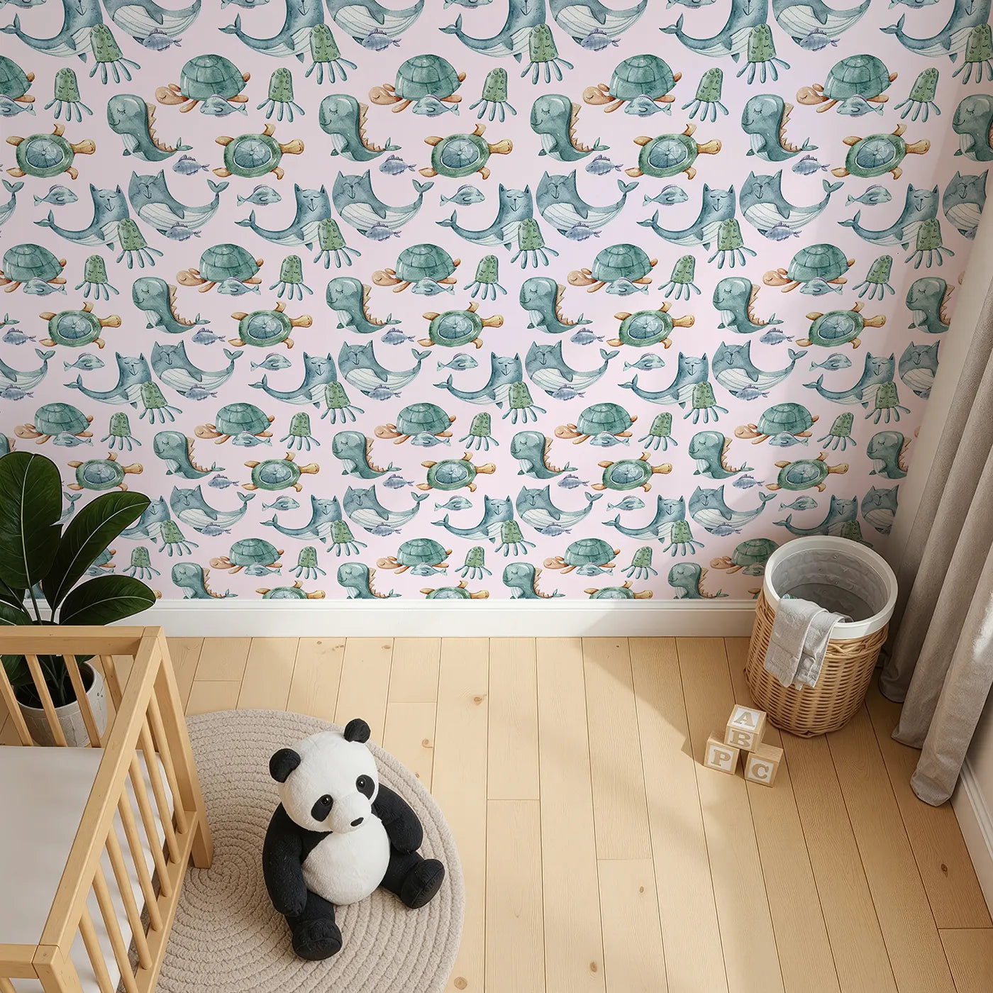 Top-Down view of Whimsy Tots' Ocean Daydream Creatures Wallpaper in Blush Pink (W3277B).Whales, turtles, and octopuses float softly through a rosy ocean dream.
