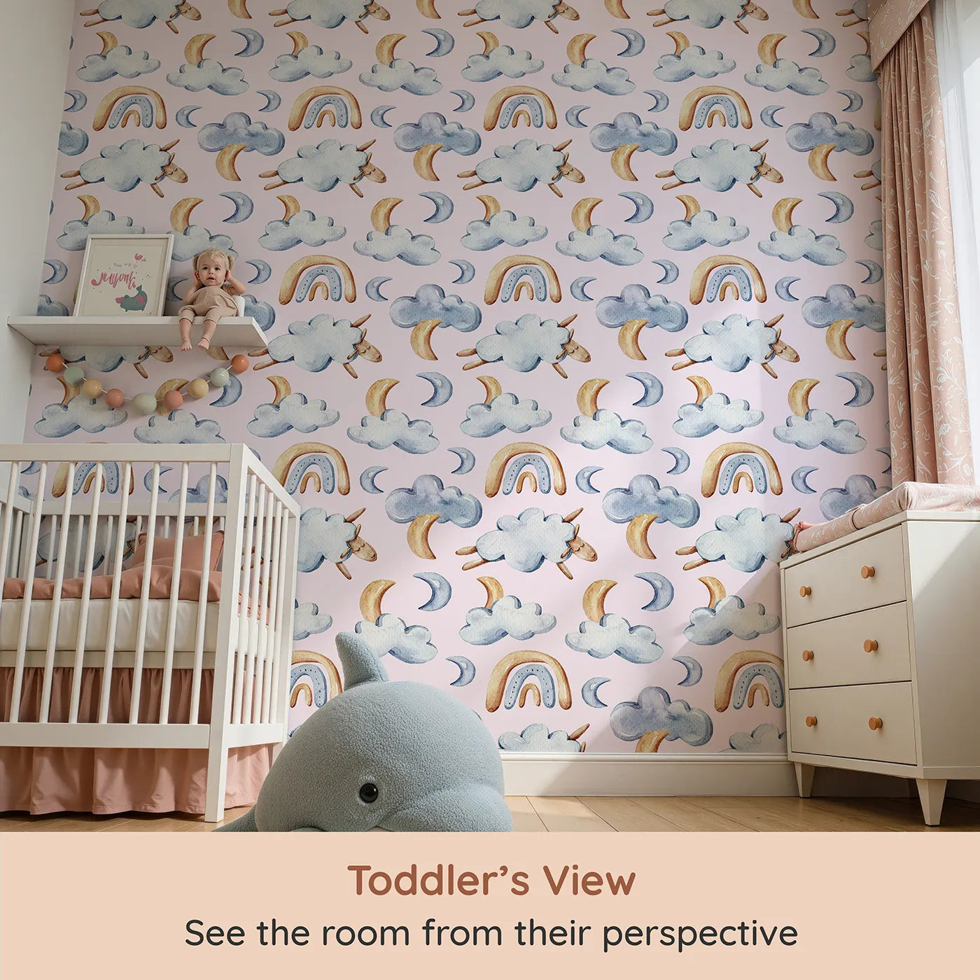 Whimsy Tots Sleepy Skies Wallpaper in Blush Pink (W3279B) from your child's view.Crescent moons and cozy sheep float through a soft pink sky of dreams.