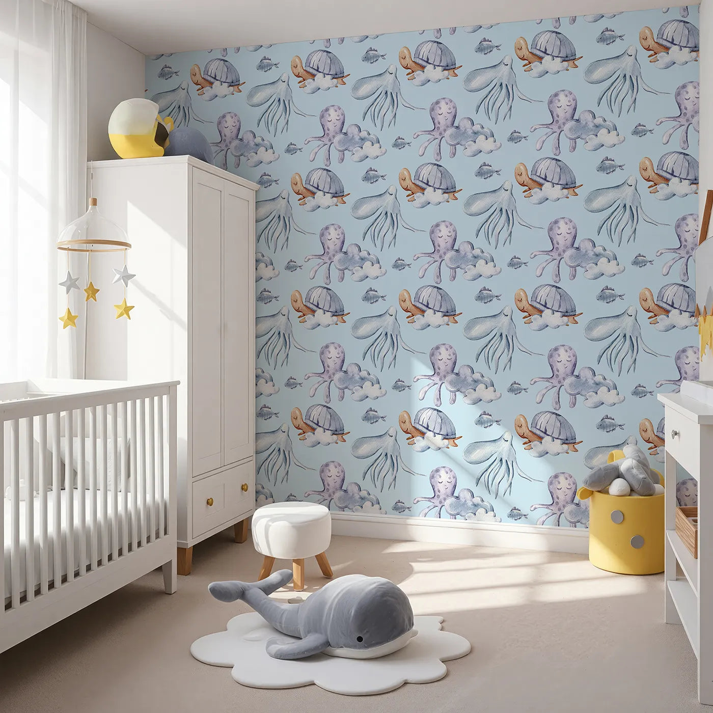 Angled view of Whimsy Tots' Ocean Dreams Wallpaper in Blue (W3281E).Turtles, octopuses, and fish float gently through a soft ocean sky.
