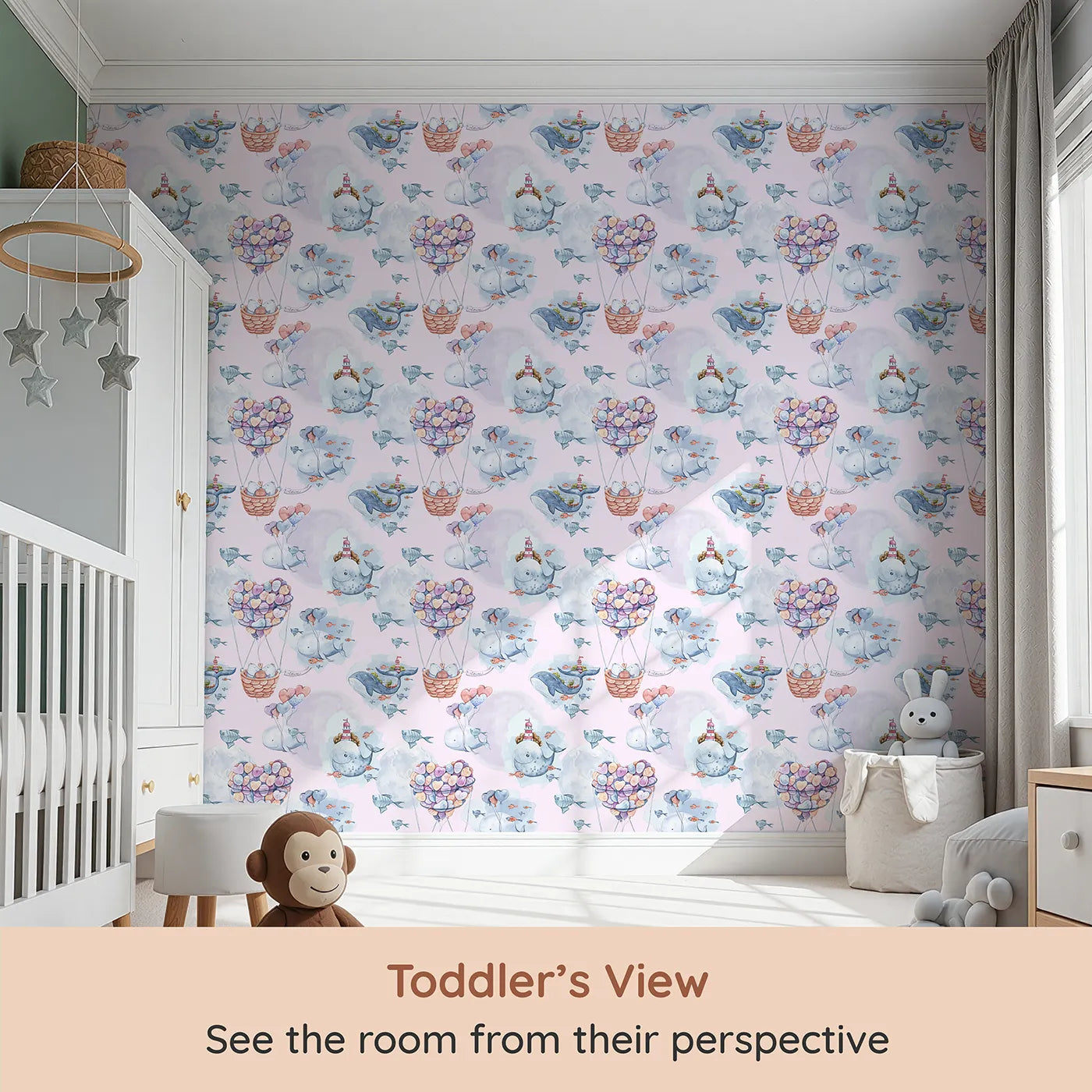 Whimsy Tots Whales of Love Wallpaper in Blush Pink (W3282B) from your child's view.Whales drift through blush skies, carrying heart balloons and love.