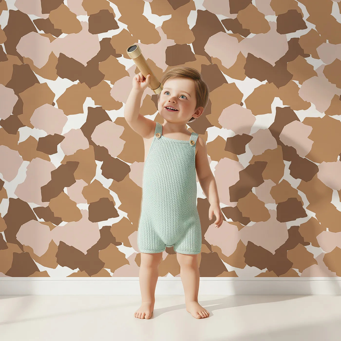 Lovely child standing in front of Whimsy Tots Savanna Giraffe Scatter Wallpaper with spot, shape, giraffe in design.