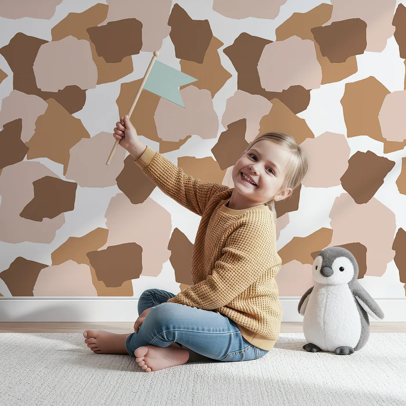 Lovely child standing in front of Whimsy Tots Savanna Giraffe Tumble Wallpaper with spot, shape, giraffe in design.