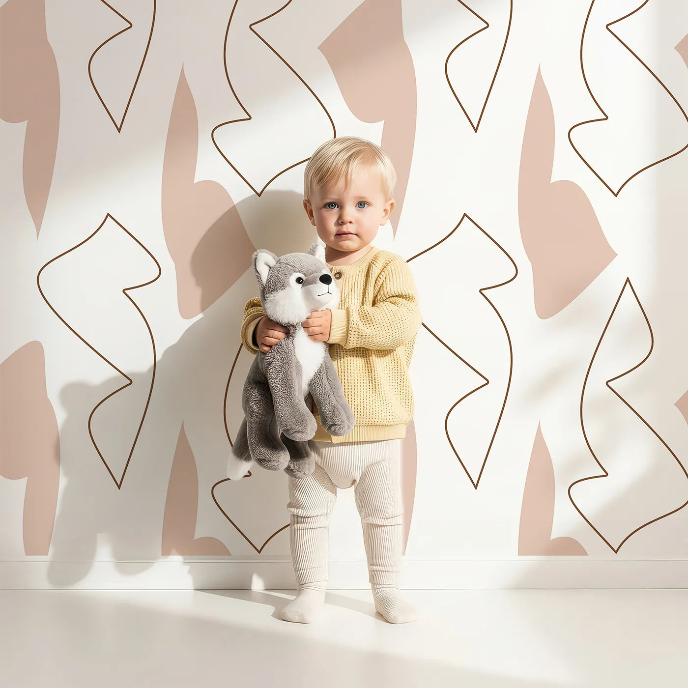 Lovely child standing in front of Whimsy Tots Abstract Dune Curves Wallpaper with line, shape, abstract in design.