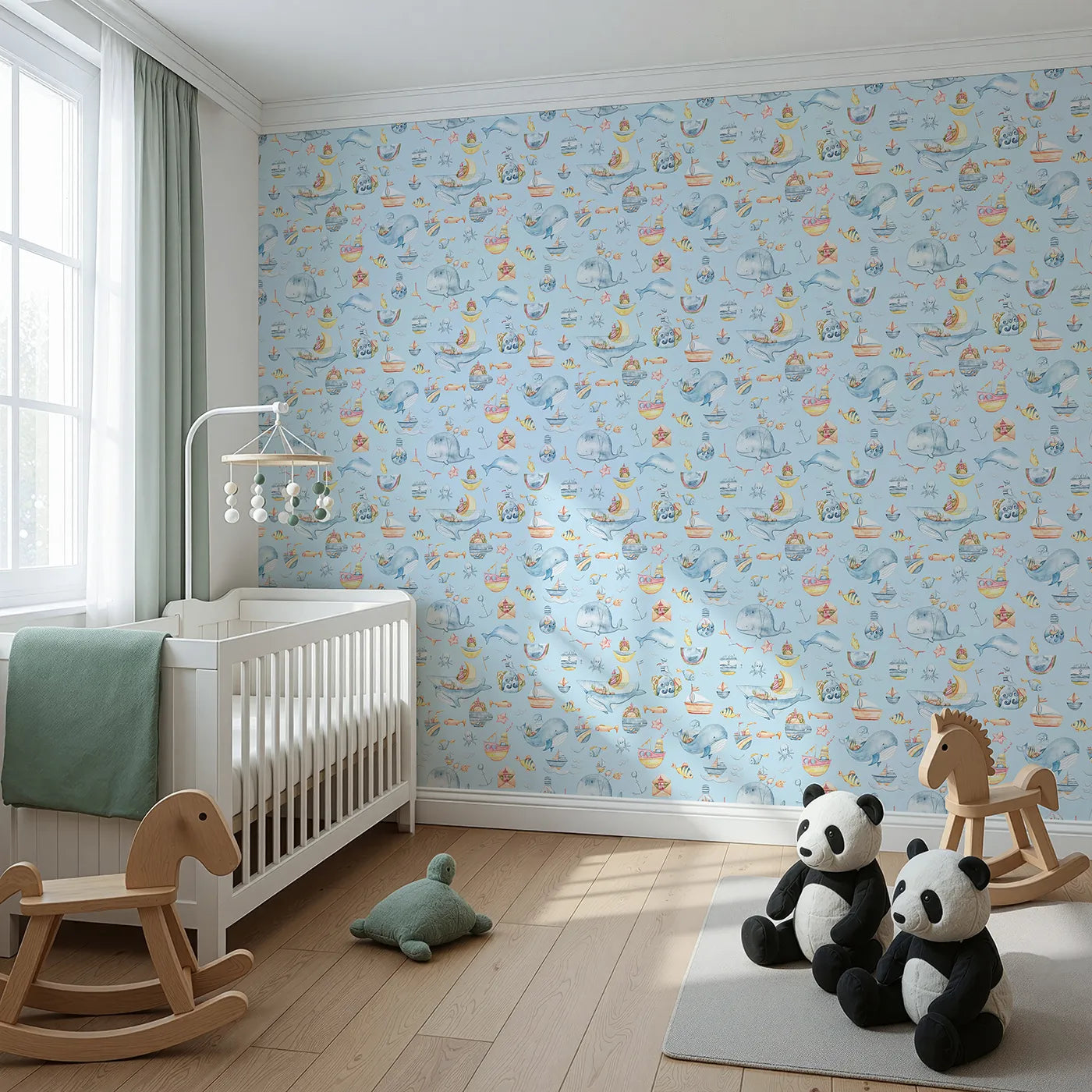 Angled view of Whimsy Tots' Whale Mail Wallpaper in Sky Blue (W3313E).Cheerful whales swim across blue skies with mail, mugs, and marine treasures.