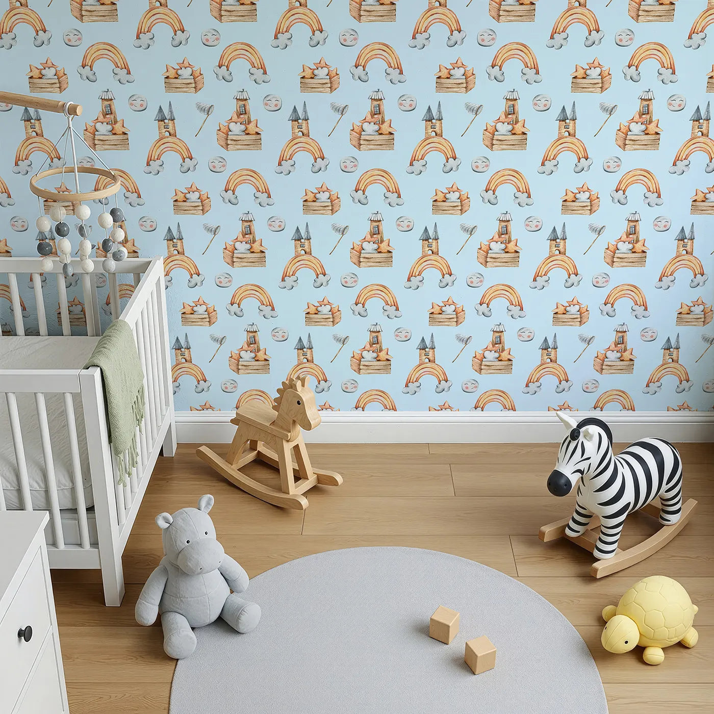 Top-Down view of Whimsy Tots' Rainbow Castle Dreams Wallpaper in Blue (W3314E).Playful stars and smiling moons float over a sea of blue sky dreams.