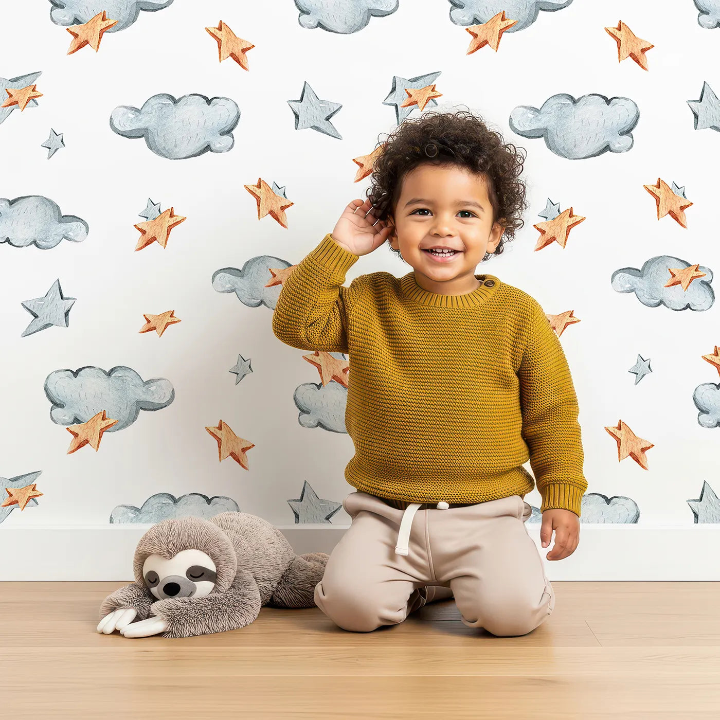 Lovely child standing in front of Whimsy Tots Cloudy Star Drift Wallpaper in White with star, cloud in design.