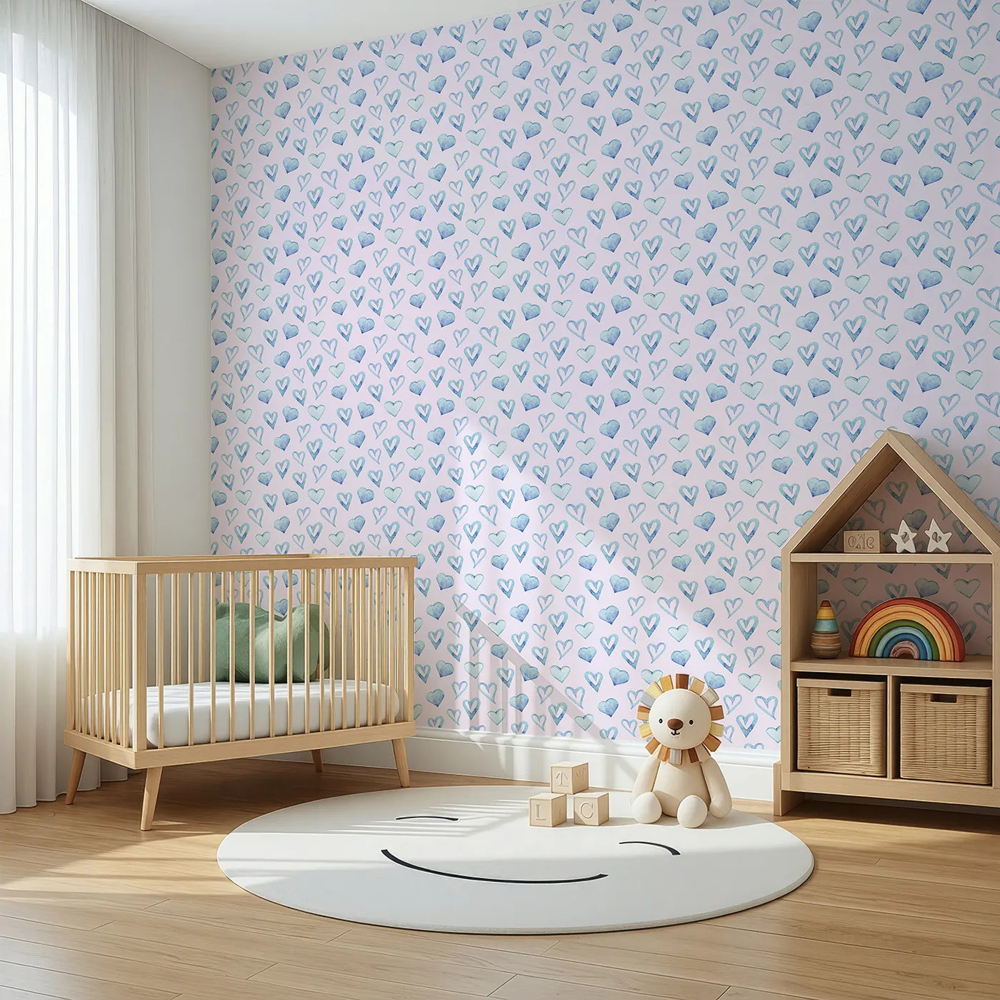 Angled view of Whimsy Tots' Blue Hearts Wallpaper in Blush (W3330B).Watercolor hearts in soft blue and blush bring warmth and care to their space.
