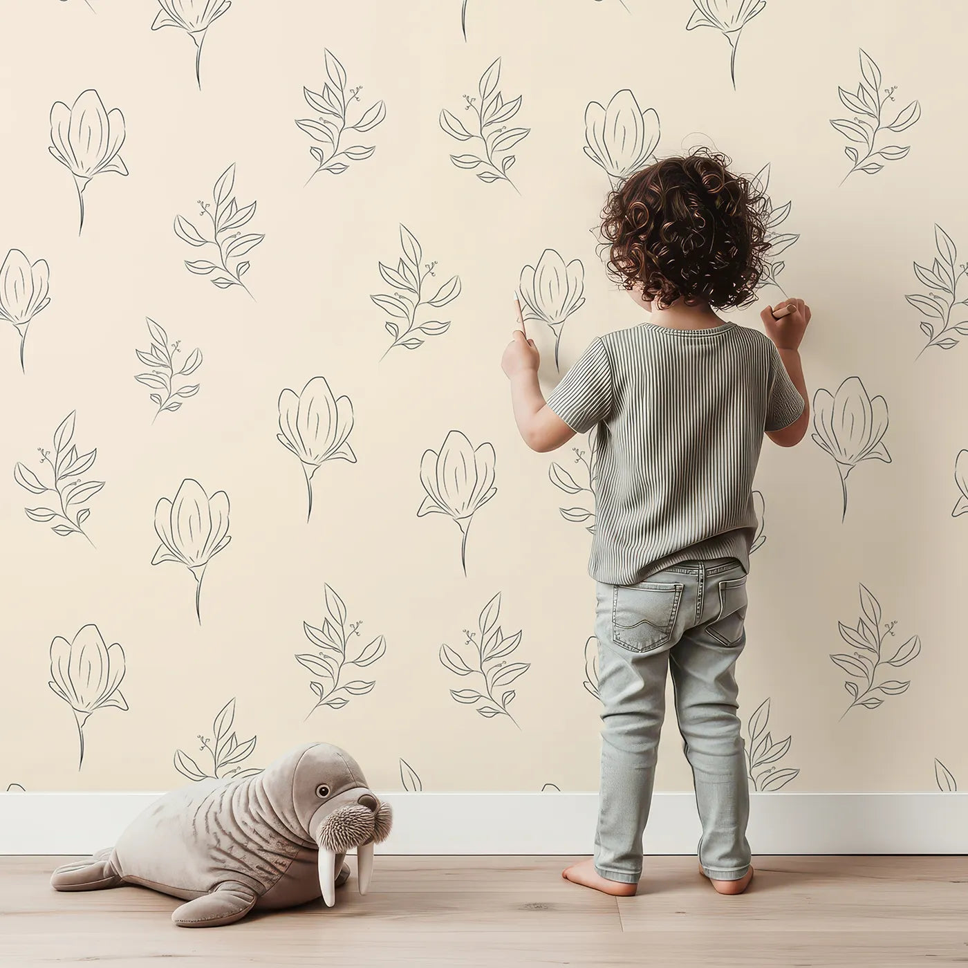 Lovely child standing in front of Whimsy Tots Floral Whisper Line Art Wallpaper in Peach with flower, leaf, blossom, lineart in design.