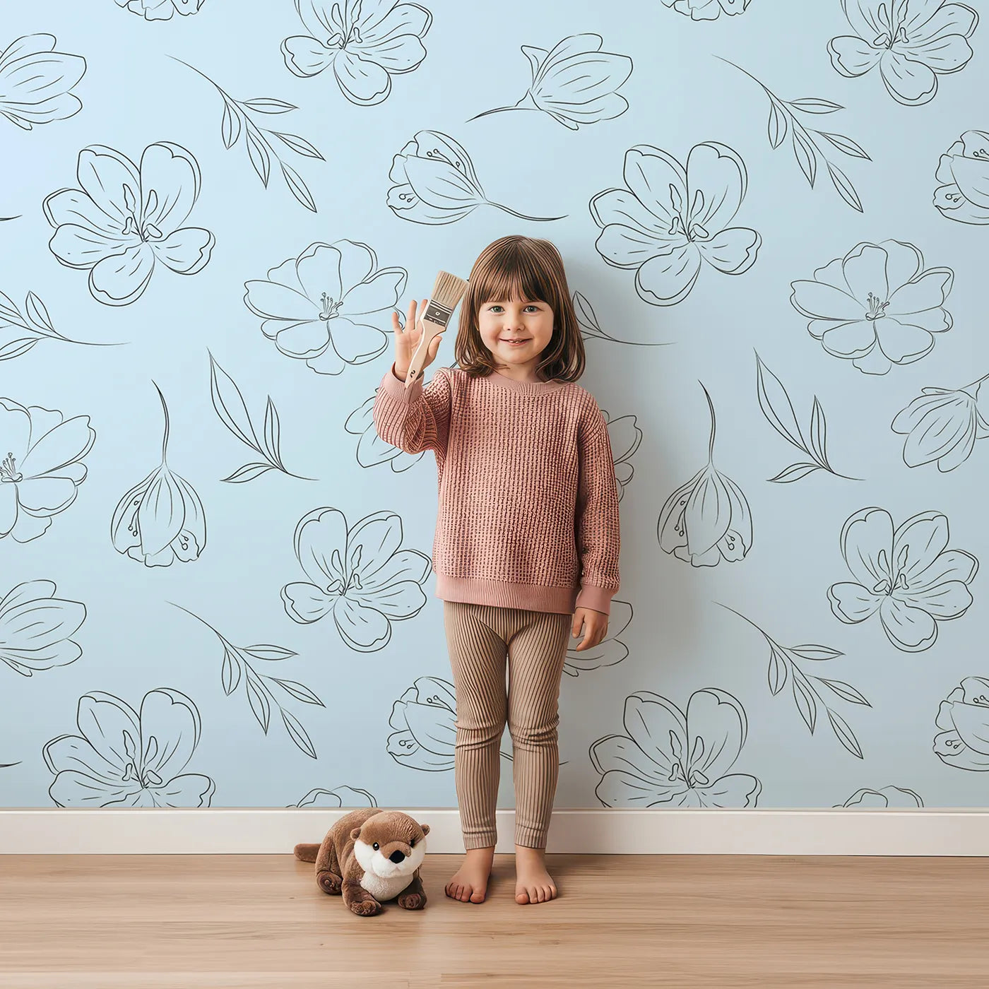 Lovely child standing in front of Whimsy Tots Line Art Bloom Wallpaper in Blue with flower, blossom, lineart, leaf in design.