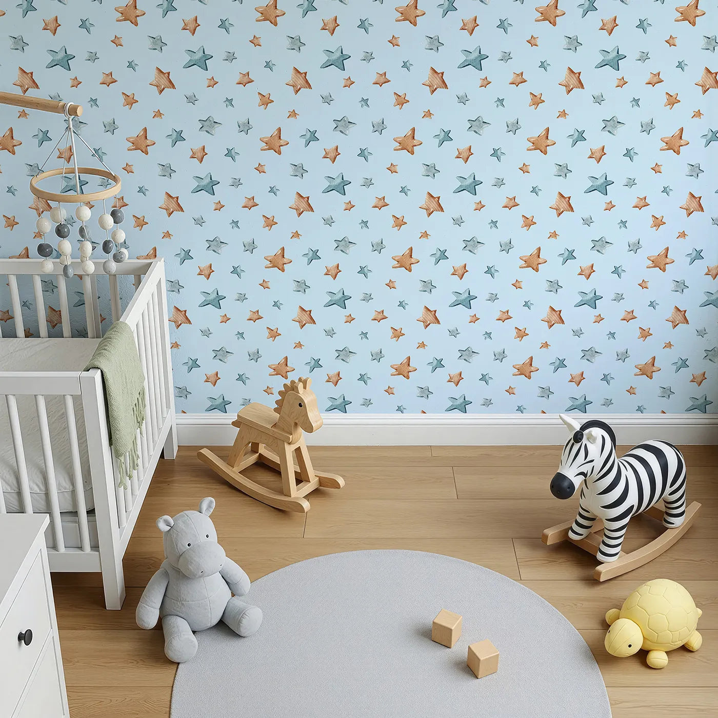 Top-Down view of Whimsy Tots' Starry Drift Wallpaper in Blue (W3341E).Brown and blue watercolor stars drift peacefully across powder blue skies.