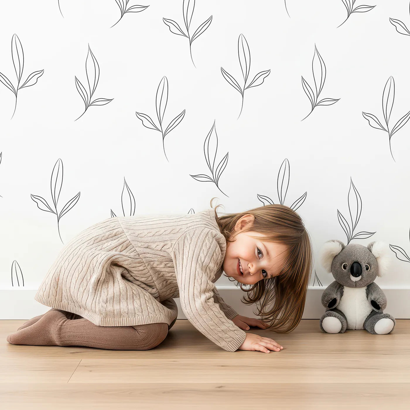 Lovely child standing in front of Whimsy Tots Line Art Leaflet in White with leaf, branch, sprig in design.