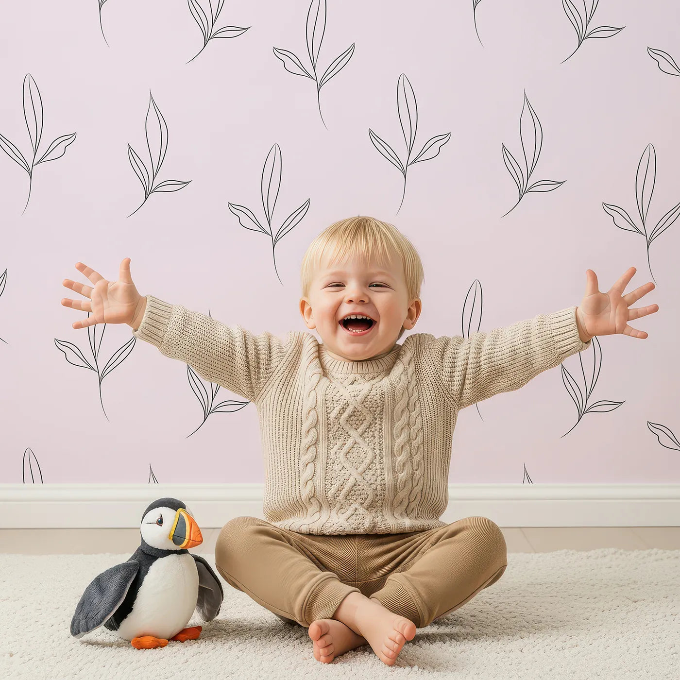 Lovely child standing in front of Whimsy Tots Line Art Leaflet in Blush Pink with leaf, sprig, branch in design.