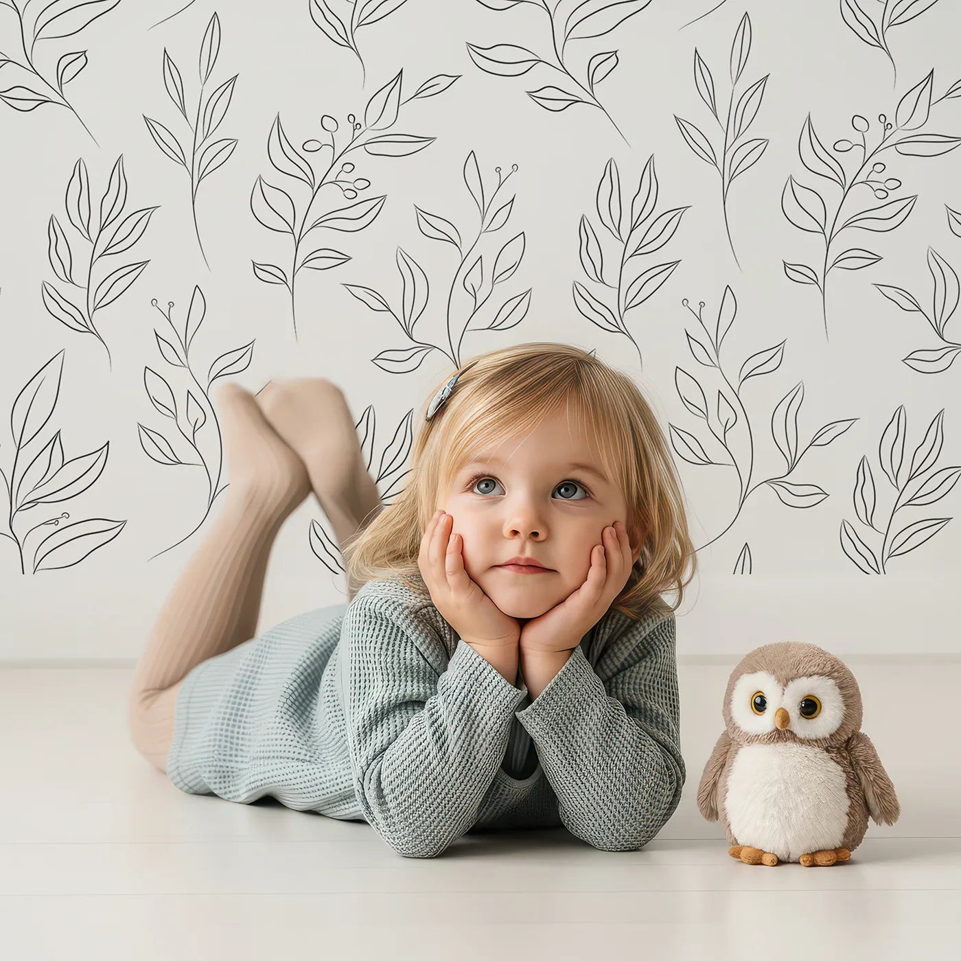 Lovely child standing in front of Whimsy Tots Botanical Sketch Garden in White with leaf, berry, branch, sprig in design.