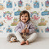 Lovely child standing in front of Whimsy Tots Seaside Story Friends in White with octopus, turtle, whale, dolphin, fish, bottle, island, house, boat in design. Lovely child standing in front of Whimsy Tots Seaside Story Friends in White with octopus, turtle, whale, dolphin, fish, bottle, island, house, boat in design.
