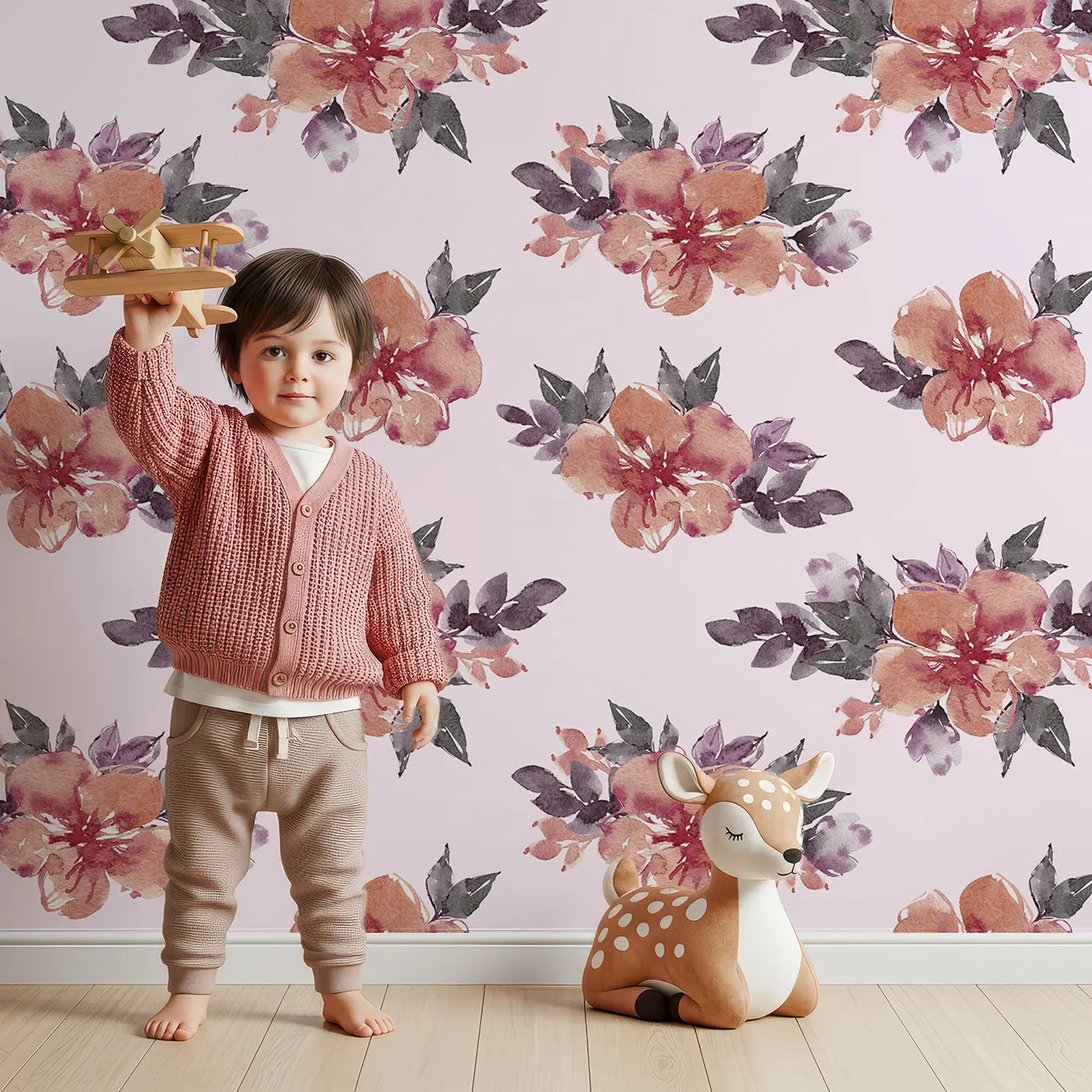 Lovely child standing in front of Whimsy Tots Berry Blush Blooms in Blush Pink with flower, petal, leaf, sprig in design.