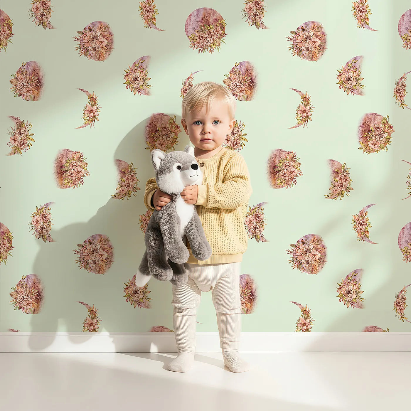 Lovely child standing in front of Whimsy Tots Moonlit Floral Whispers in Mint Green with moon, flower, blossom, petal in design.