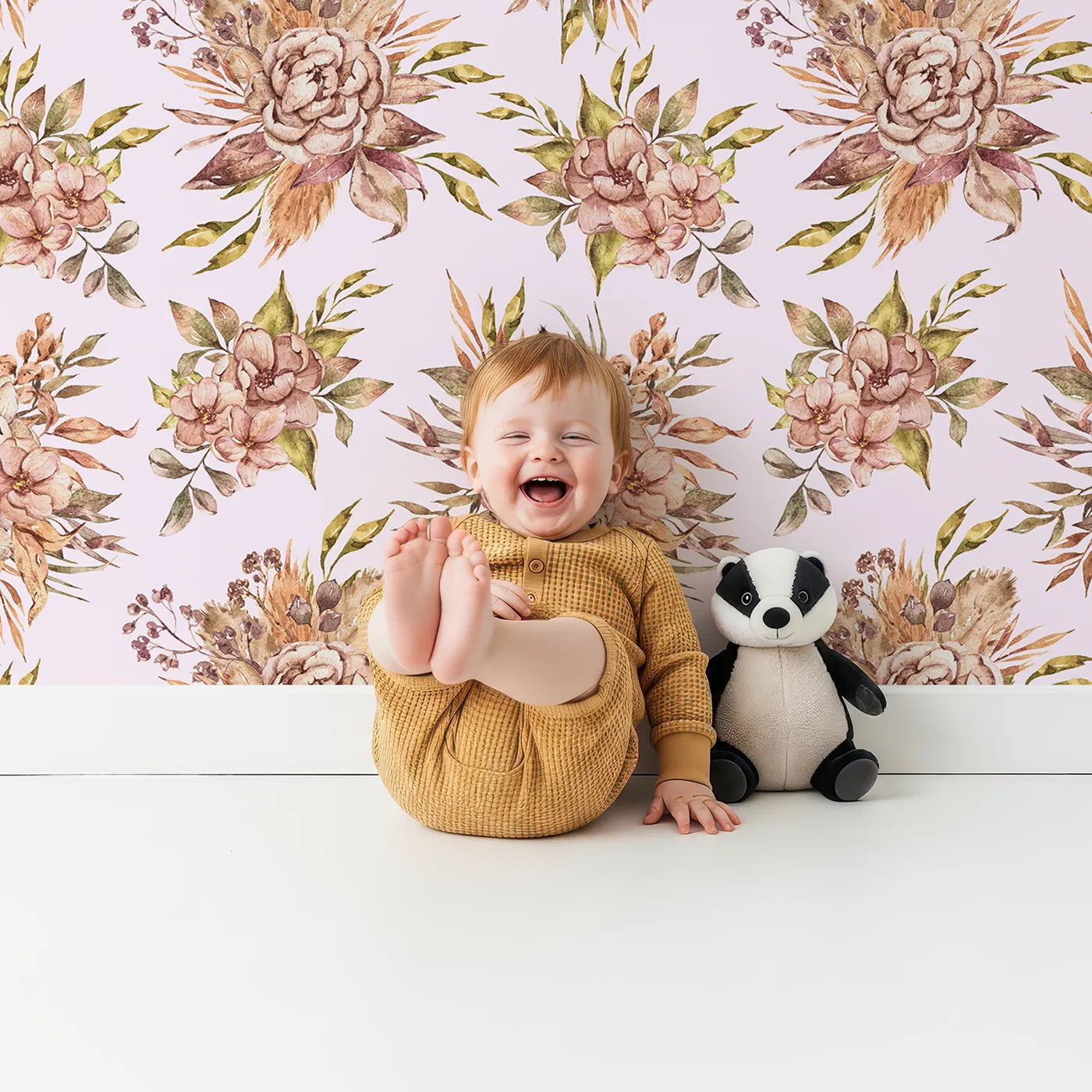 Lovely child standing in front of Whimsy Tots Autumn Bloom Harmony Wallpaper in Blush Pink with flower, bouquet, rose, peony in design.