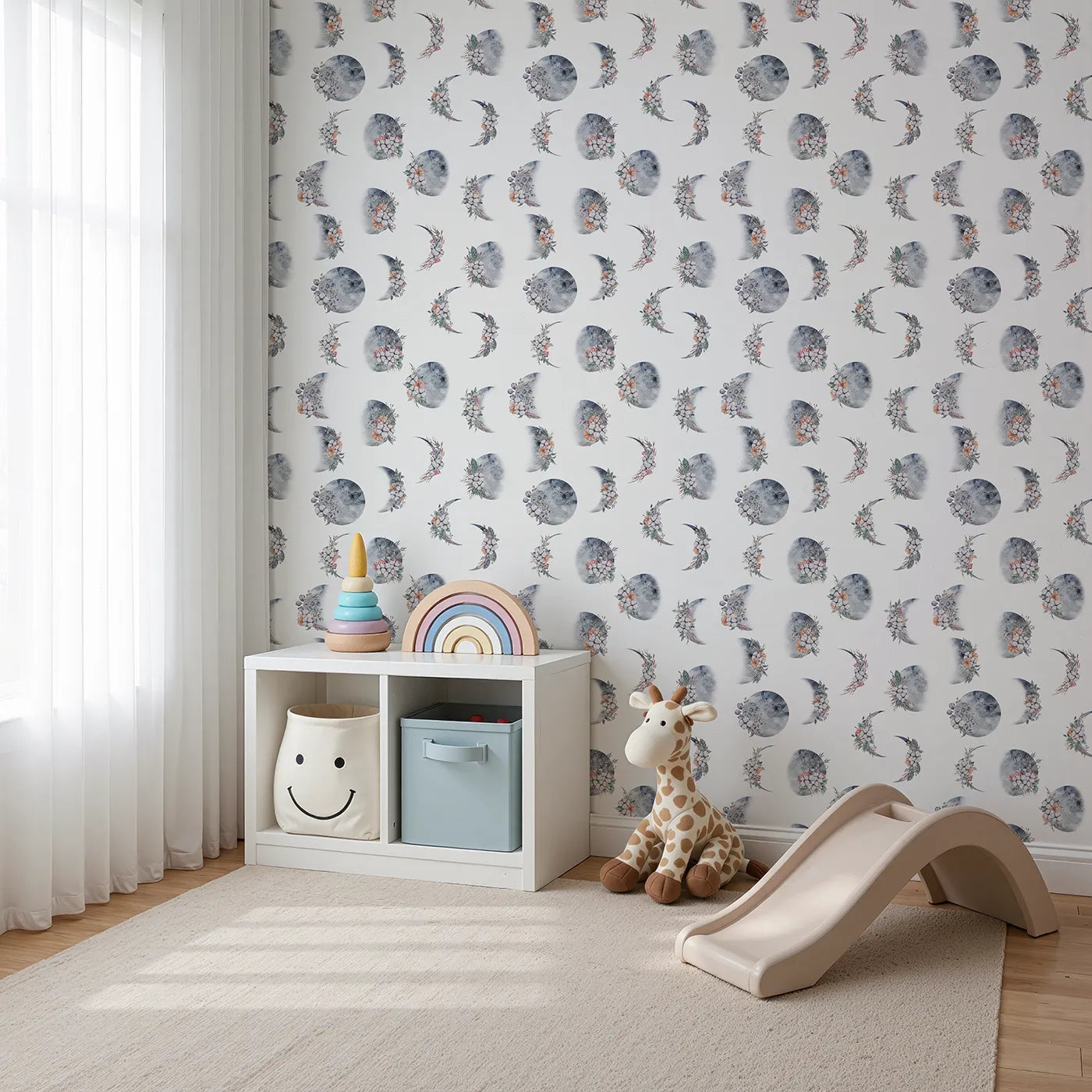 Angled view of Whimsy Tots' Celestial Winter Blooms Wallpaper in White (W3370A).Watercolor moons bloom with cotton, berries, and frost-kissed leaves.