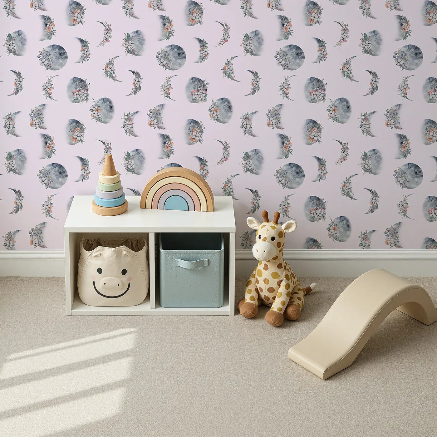 Top-Down view of Whimsy Tots' Celestial Winter Blooms Wallpaper in Blush Pink (W3370B).Moon phases bloom gently with winter florals on a blush sky.