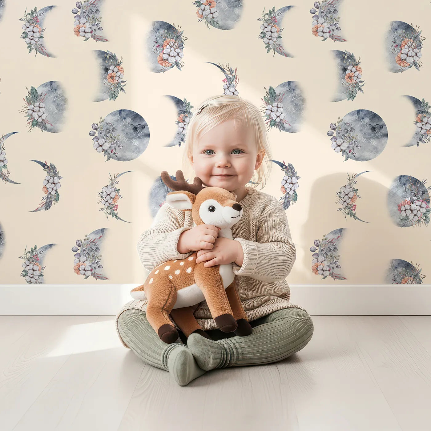 Lovely child standing in front of Whimsy Tots Celestial Winter Blooms Wallpaper in Cream with moon, flower, cotton, eucalyptus in design.