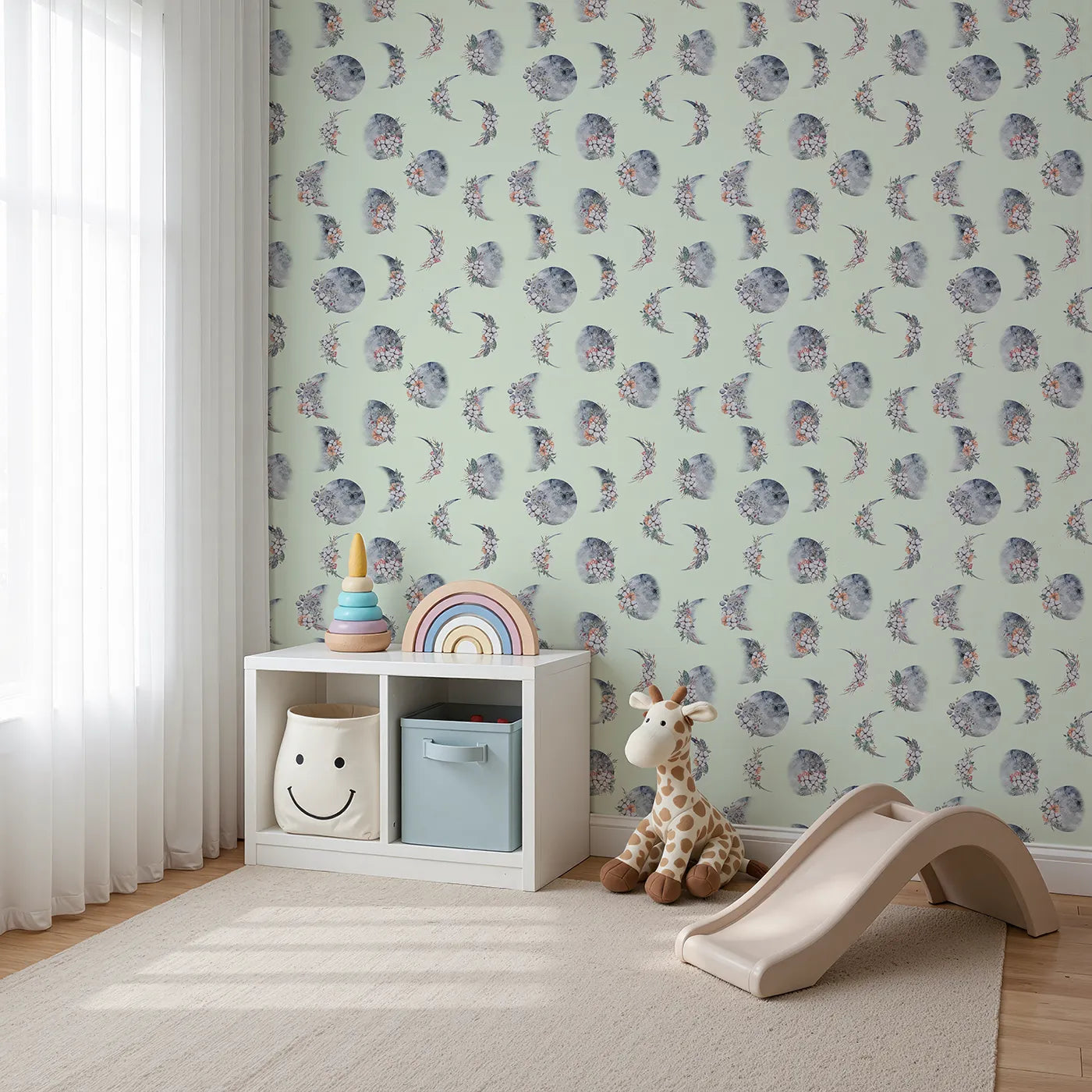 Angled view of Whimsy Tots' Celestial Winter Blooms Wallpaper in Mint Green (W3370D).Celestial moons and floral sprigs float across a minty sky.