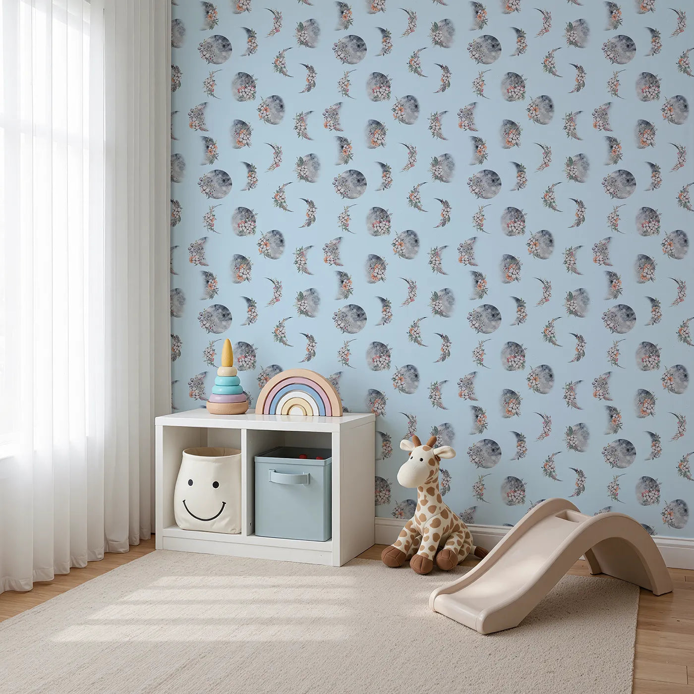 Angled view of Whimsy Tots' Celestial Winter Blooms Wallpaper in Sky (W3370E).Moons and winter florals drift softly across a serene sky-blue breeze.