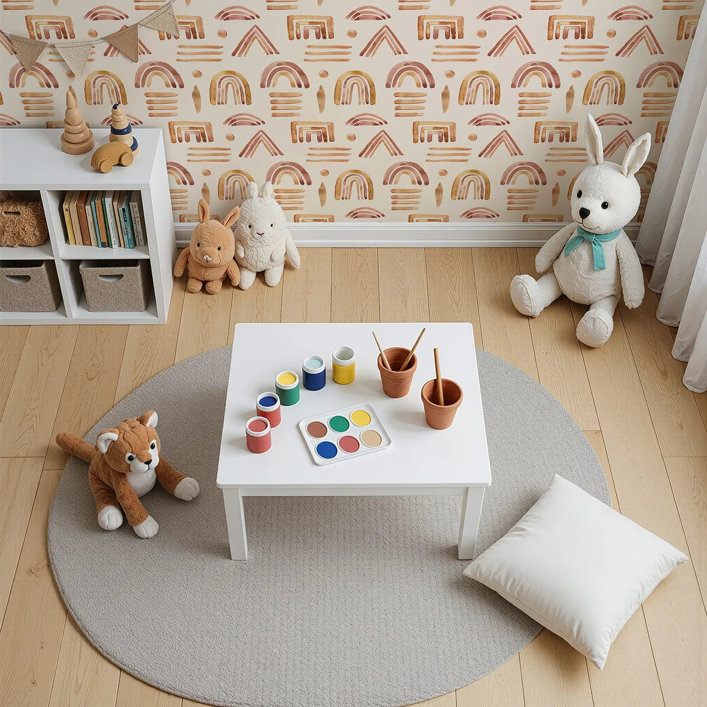 Top-Down view of Whimsy Tots' Sun-Drenched Shapes Wallpaper in Blush Pink (W3376C).Blushy brushstrokes and earthy rainbows spark joy in every corner.