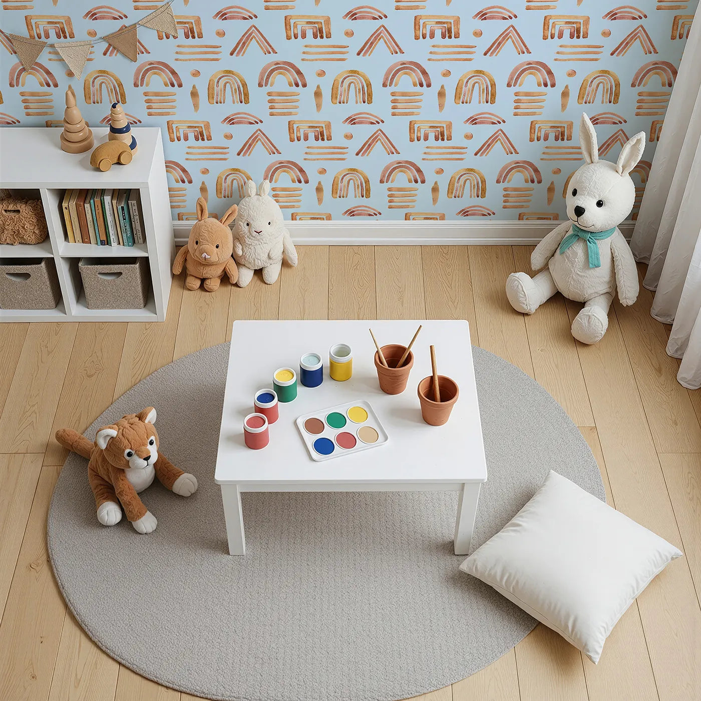 Top-Down view of Whimsy Tots' Sun-Drenched Shapes Wallpaper in Sky (W3376E).Earthy rainbows float softly on a sky-blue daydream.