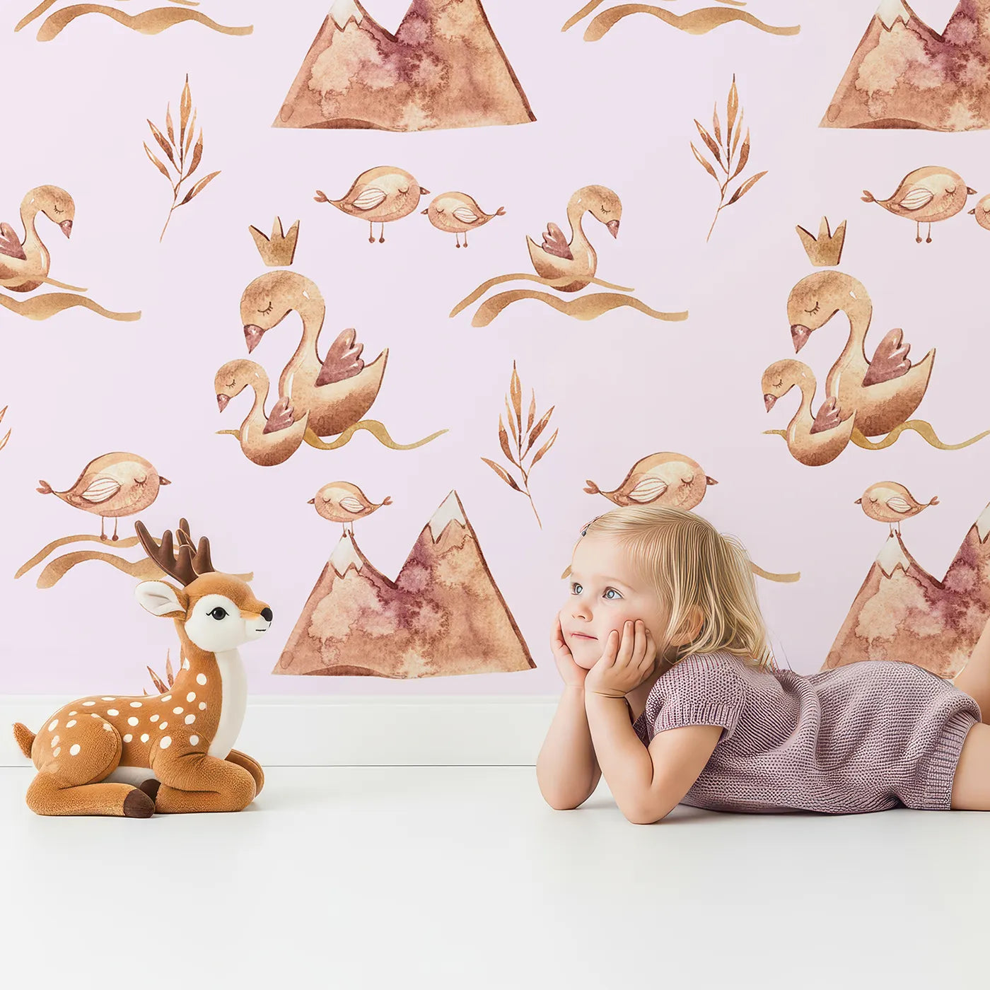 Lovely child standing in front of Whimsy Tots Feathered Serenity Wallpaper in Blush with bird, swan, crown, mountain, wing in design.