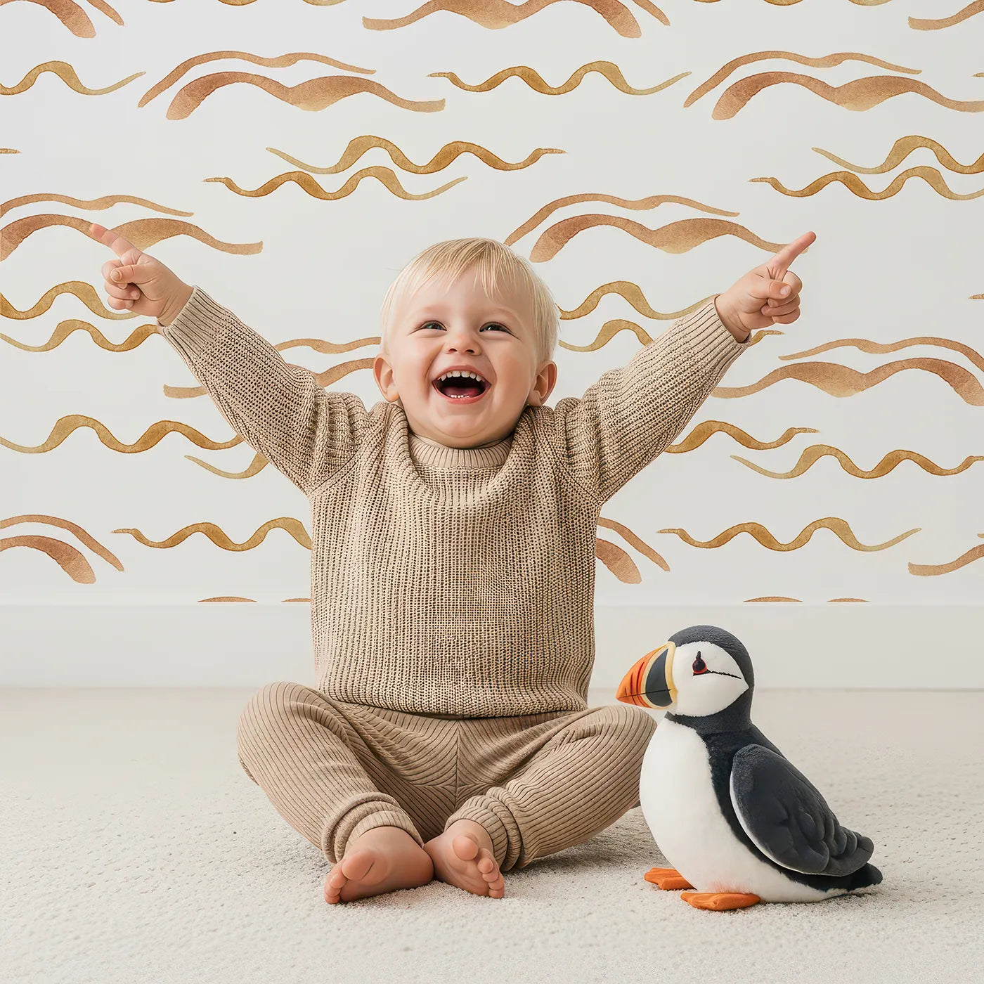 Lovely child standing in front of Whimsy Tots Soft Wave Rhythm Wallpaper in White with wave, curve, line, brushstroke, abstract in design.