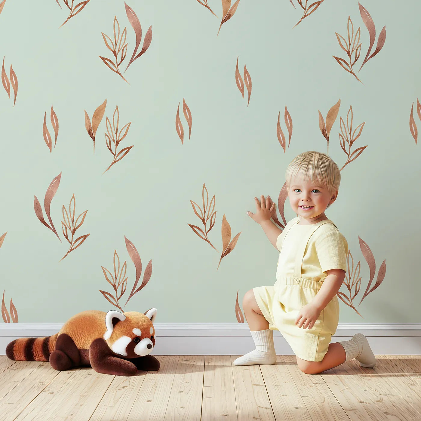 Lovely child standing in front of Whimsy Tots Rustling Meadow Sprigs Wallpaper in Mint Green with leaf, sprig, botanical, plant in design.