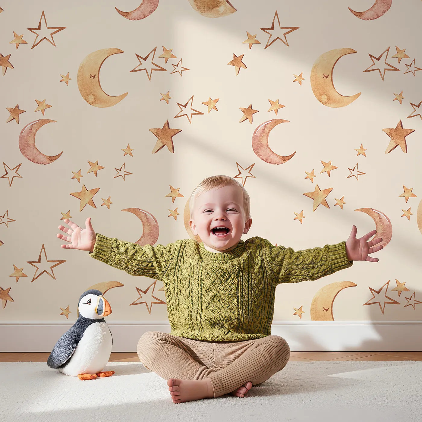 Lovely child standing in front of Whimsy Tots Sleepy Skies Shine Wallpaper in Cream with moon, star, sky, sleepy face in design.