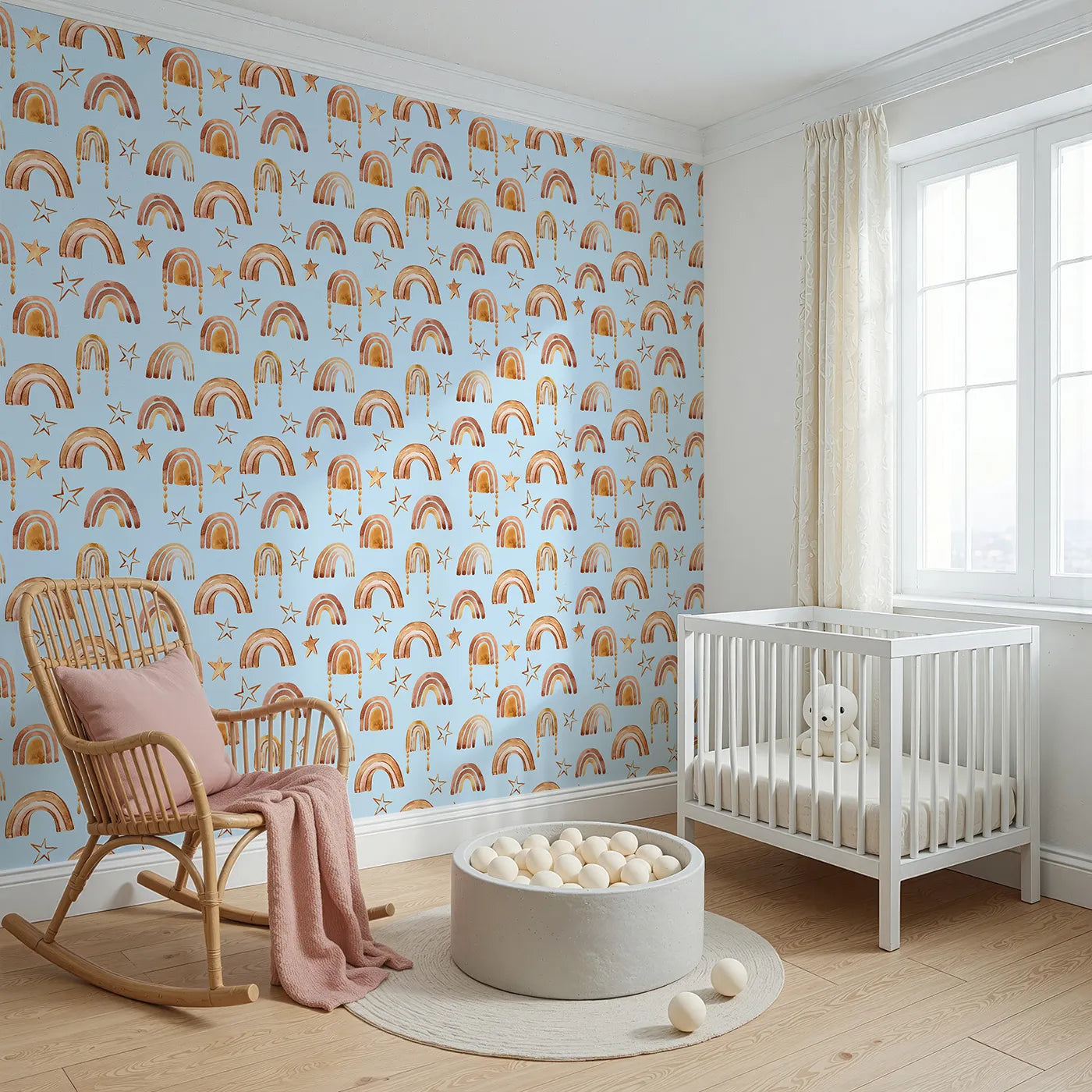 Angled view of Whimsy Tots' Golden Boho Rainbows Wallpaper in Blue (W3387E).Warm rainbows and soft golden stars drift across a baby blue sky.