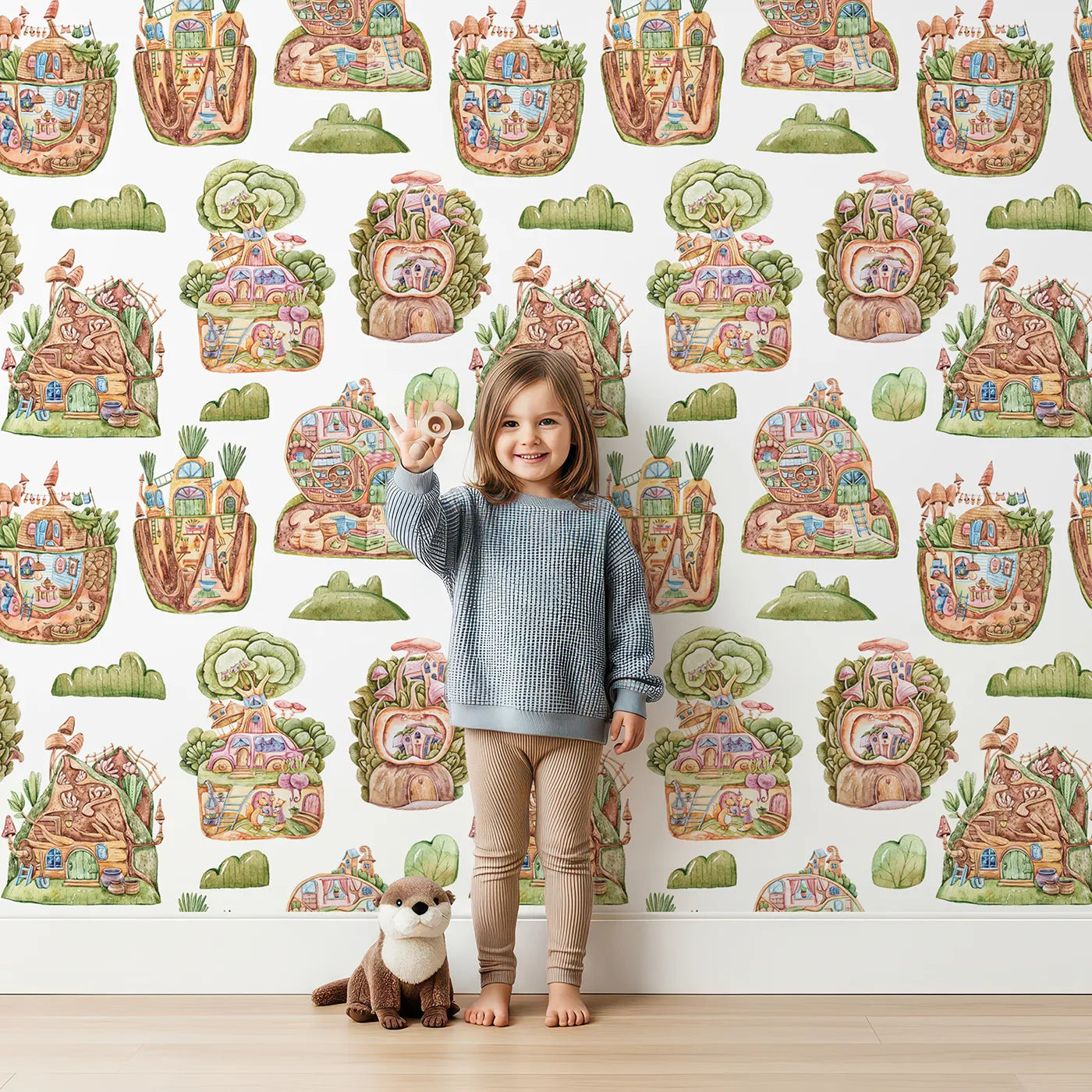 Lovely child standing in front of Whimsy Tots Secret Garden Cutaway Homes Wallpaper in White with house, mushroom, tree, root, gourd, vegetable in design.