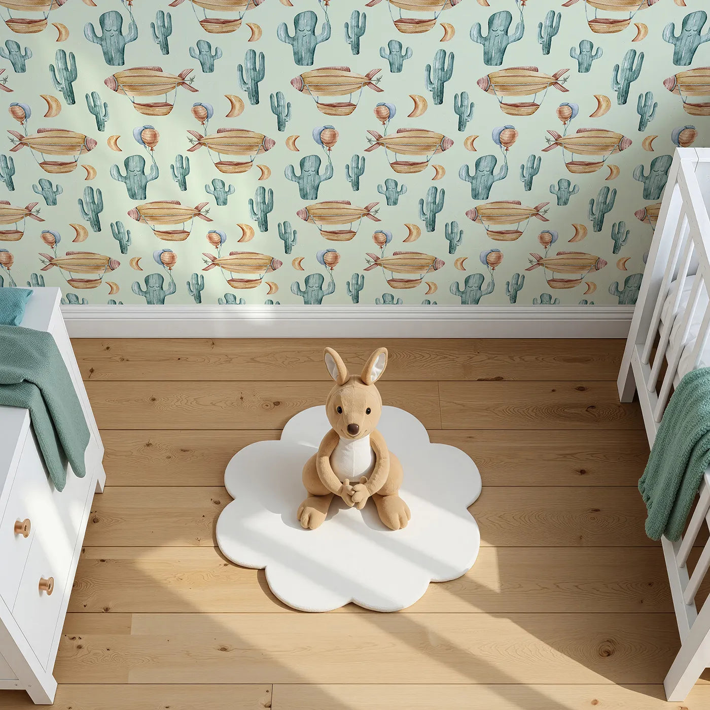 Top-Down view of Whimsy Tots' Cactus Cloud Voyage Wallpaper in Sage Green (W3391D).Soothing sage skies carry balloons, airships, and sleepy cacti across the desert breeze.