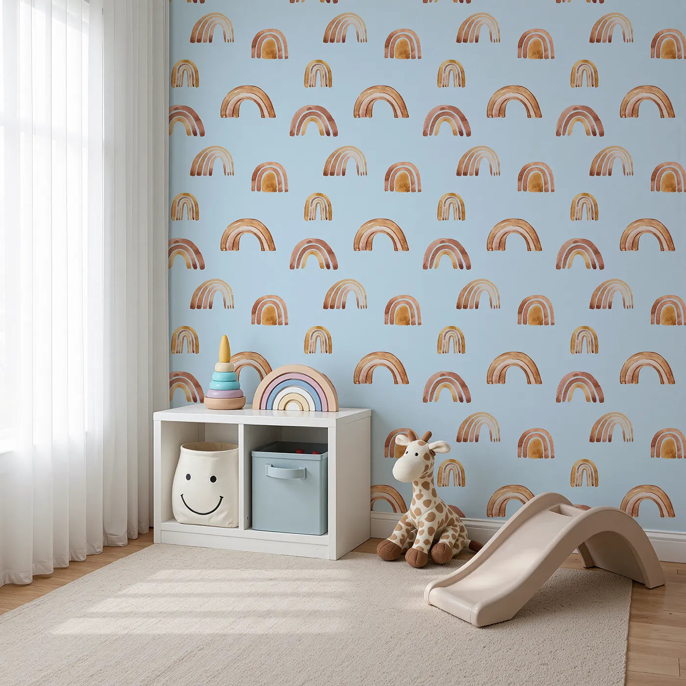 Angled view of Whimsy Tots' Boho Brush Rainbow Wallpaper in Blue (W3398E).Warm watercolor arches drift across a soft baby blue sky.