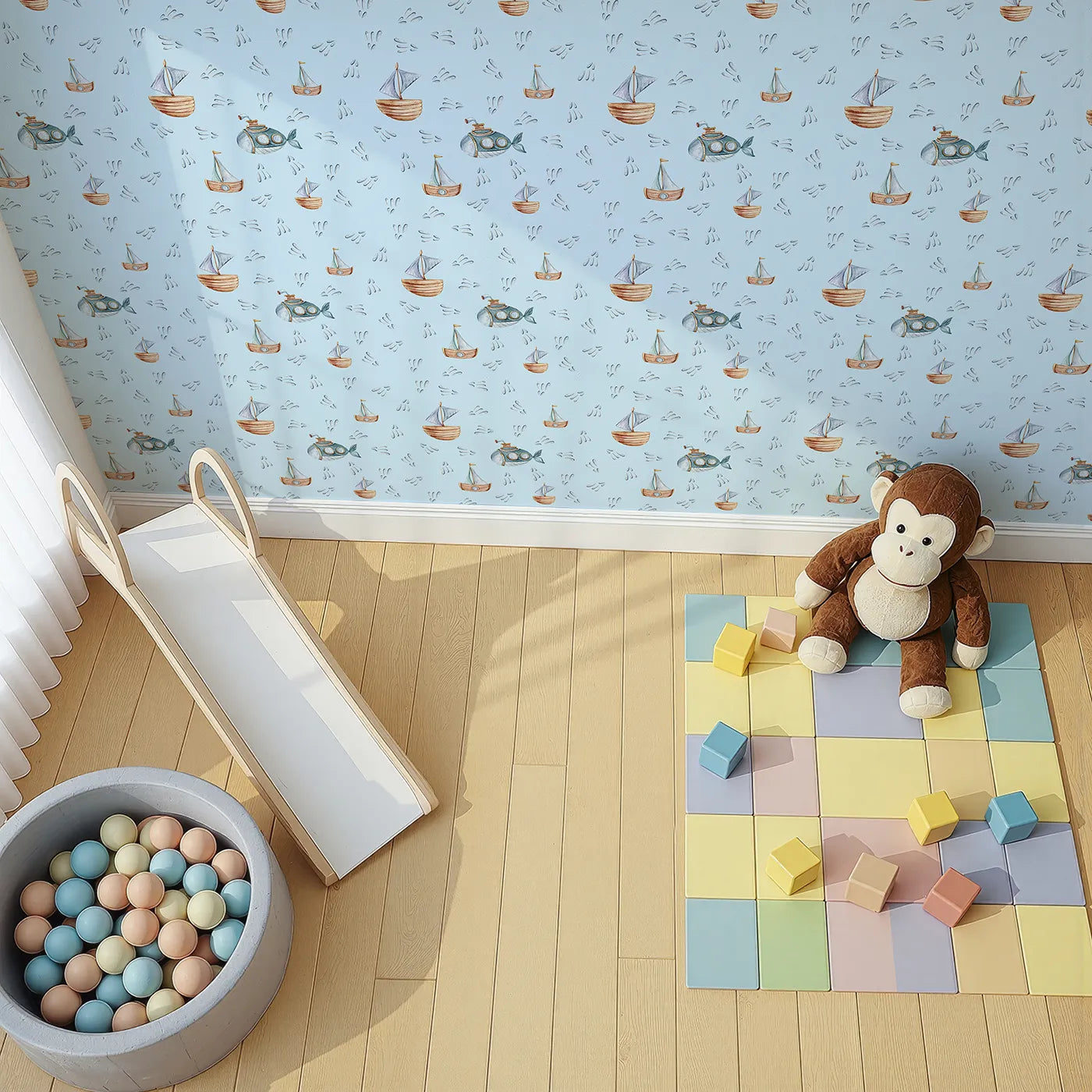 Top-Down view of Whimsy Tots' Seaside Vessel Parade Wallpaper in Blue (W3399E).Cheerful vessels and sea sprays float across a pale blue sea.