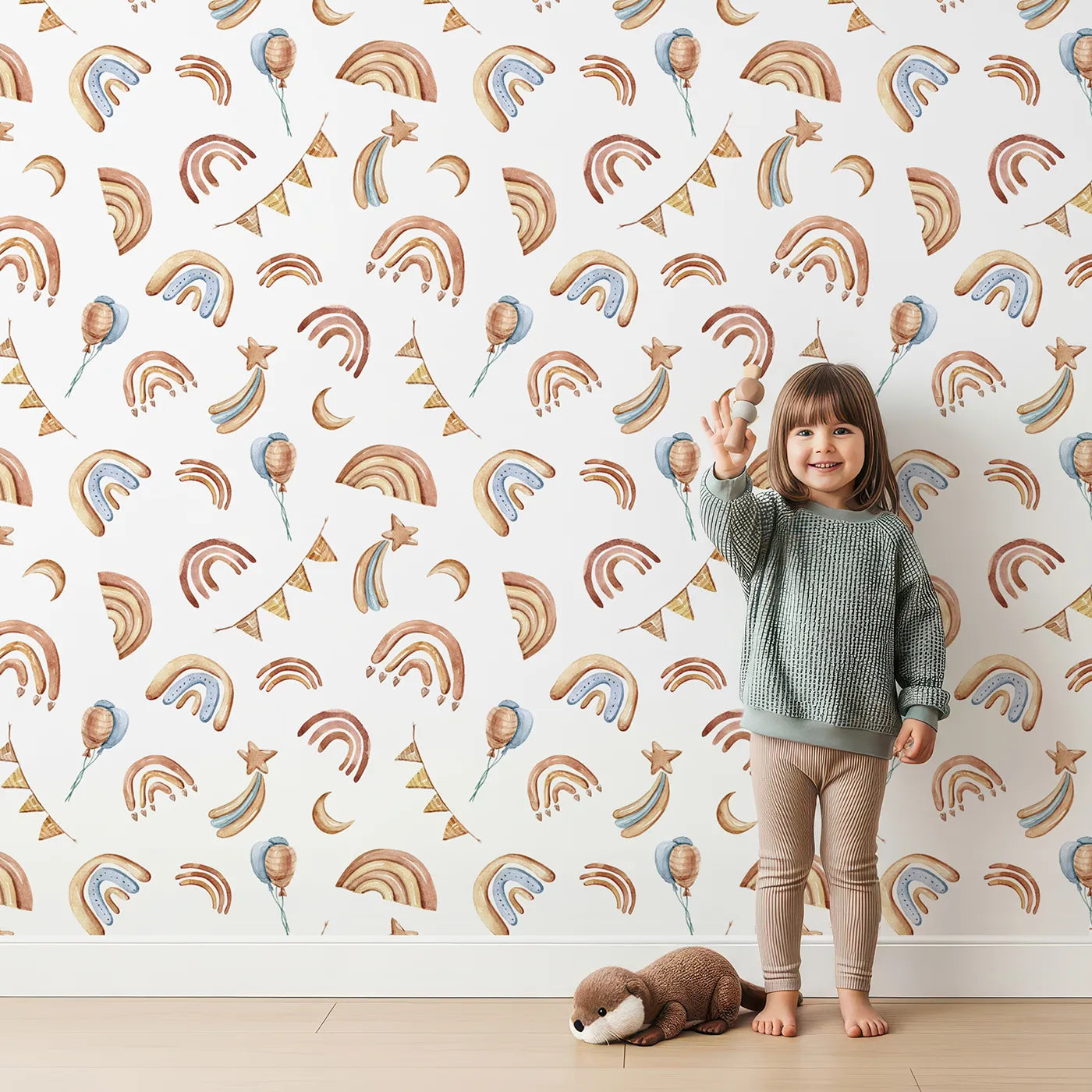 Lovely child standing in front of Whimsy Tots Sky Bloom Party Wallpaper in White with rainbow, balloon, moon, star, bunting, heart in design.