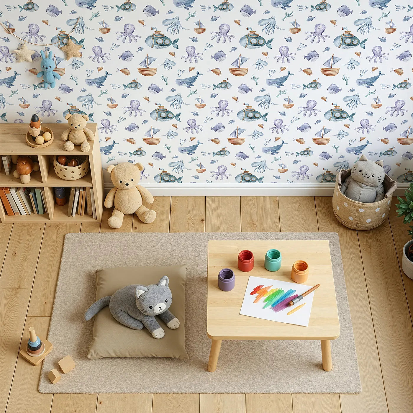 Top-Down view of Whimsy Tots' Deep Sea Discovery Wallpaper in White (W3403A).Smiling whales, submarines, and jellyfish float through dreamy underwater scenes.