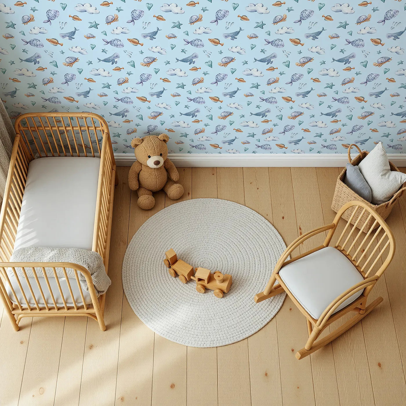 Top-Down view of Whimsy Tots' Sleepy Sea Sky Wallpaper in Blue (W3417E).Sleepy whales and gentle clouds float through a sky-blue sea.