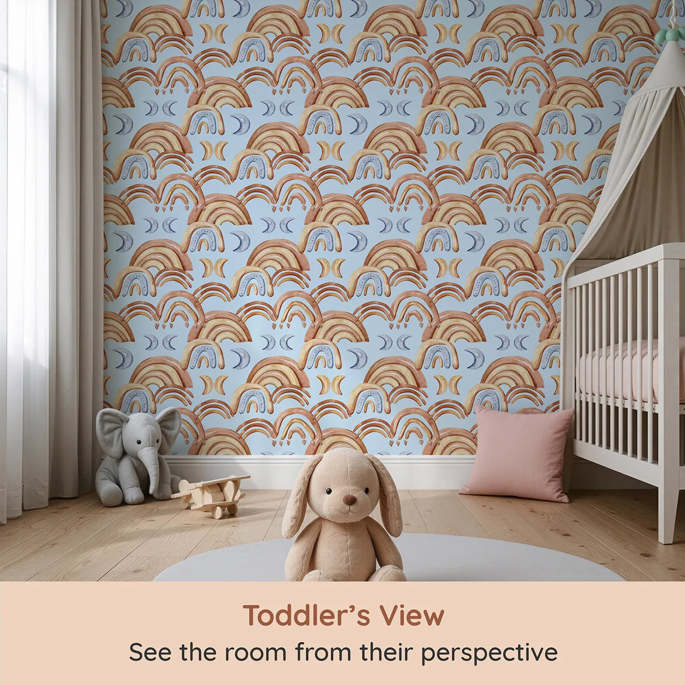 Whimsy Tots Boho Rainbow Night Wallpaper in Blue (W3423E) from your child's view.Warm arches and cool moons drift across a soft blue sky.
