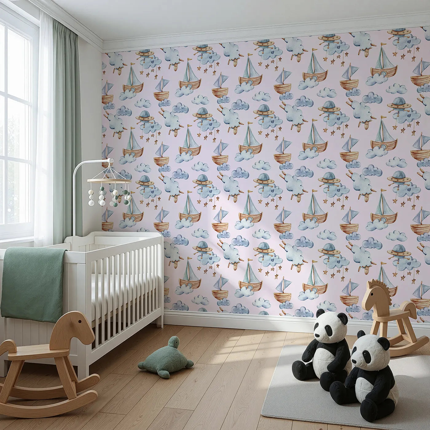 Angled view of Whimsy Tots' Counting Clouds and Sailing Dreams Wallpaper in Blush Pink (W3424B).Watercolor ships and fluffy sheep float through a pastel pink sky.