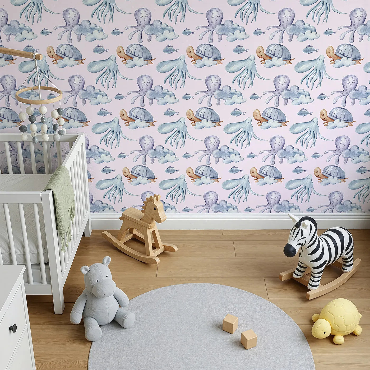 Top-Down view of Whimsy Tots' Ocean Cloud Cuddle Wallpaper in Blush Pink (W3425B).Sleepy turtles and octopuses nestle on watercolor clouds.