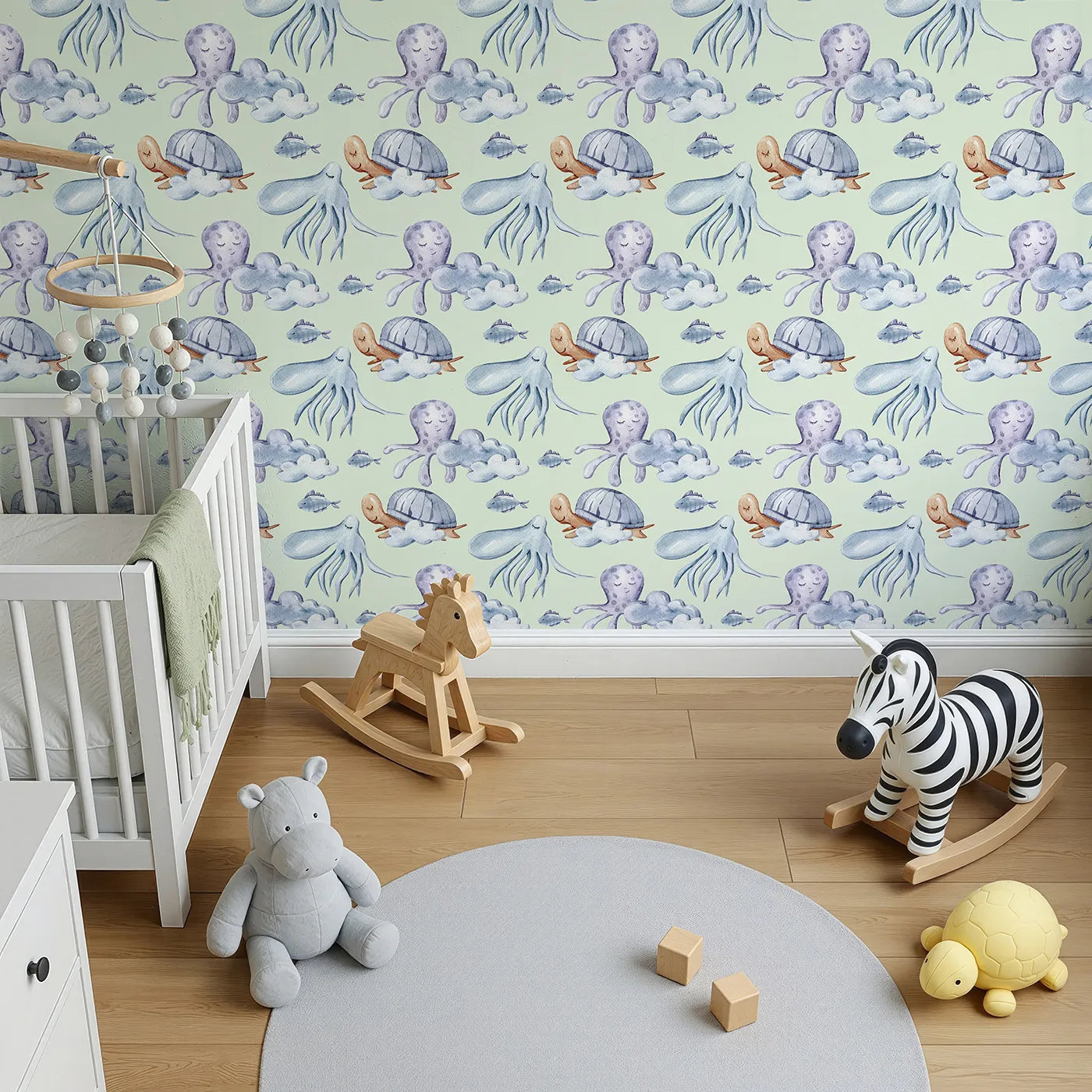 Top-Down view of Whimsy Tots' Ocean Cloud Cuddle Wallpaper in Mint Green (W3425D).Sleepy turtles and octopuses nestle on watercolor clouds.