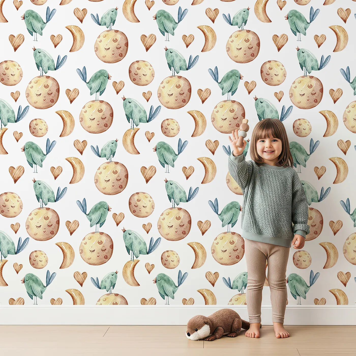 Lovely child standing in front of Whimsy Tots Lunar Lullaby Birds Wallpaper in White with bird, moon, heart in design.