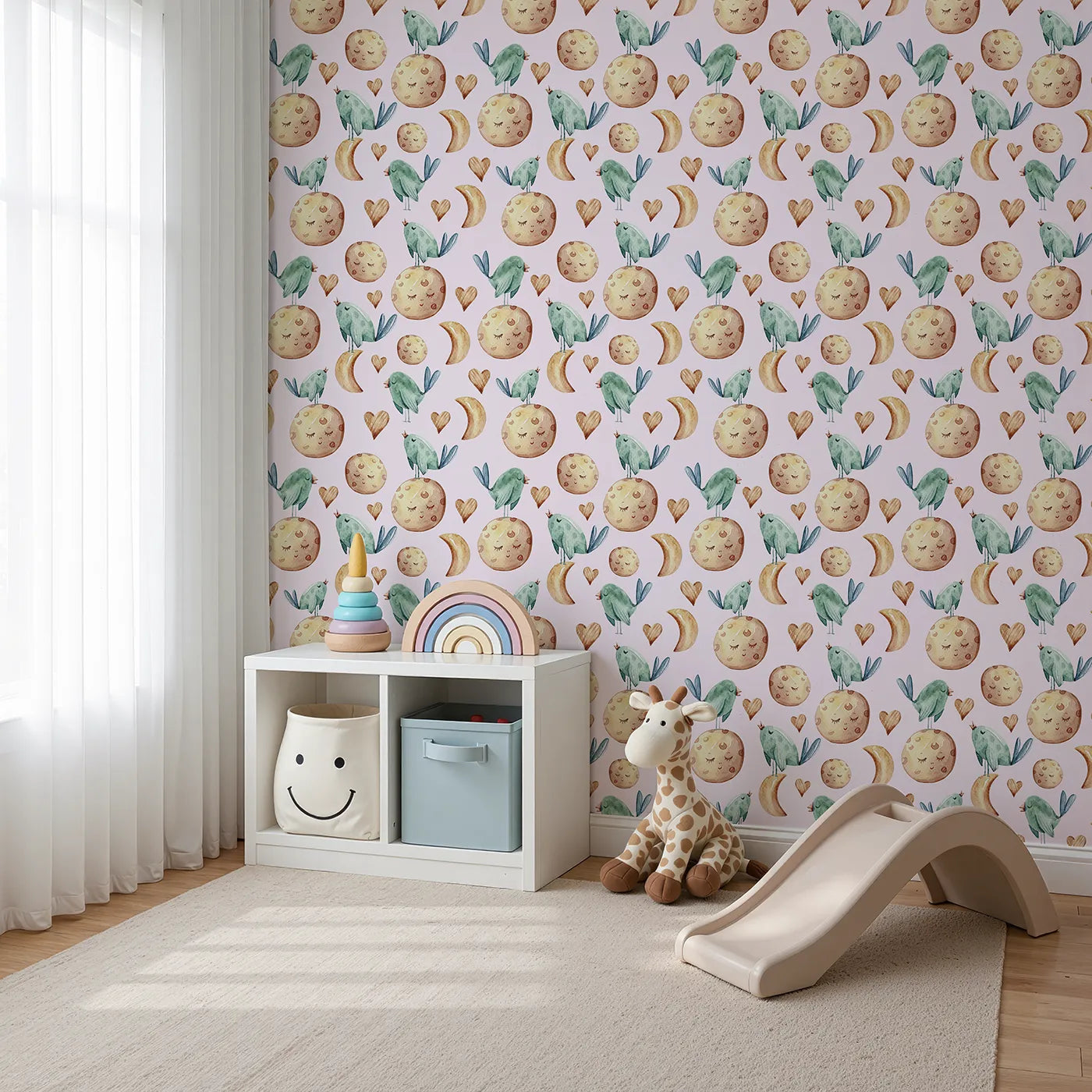 Angled view of Whimsy Tots' Lunar Lullaby Birds Wallpaper in Blush Pink (W3426B).Singing birds and dreamy moons float across a rosy pink sky.