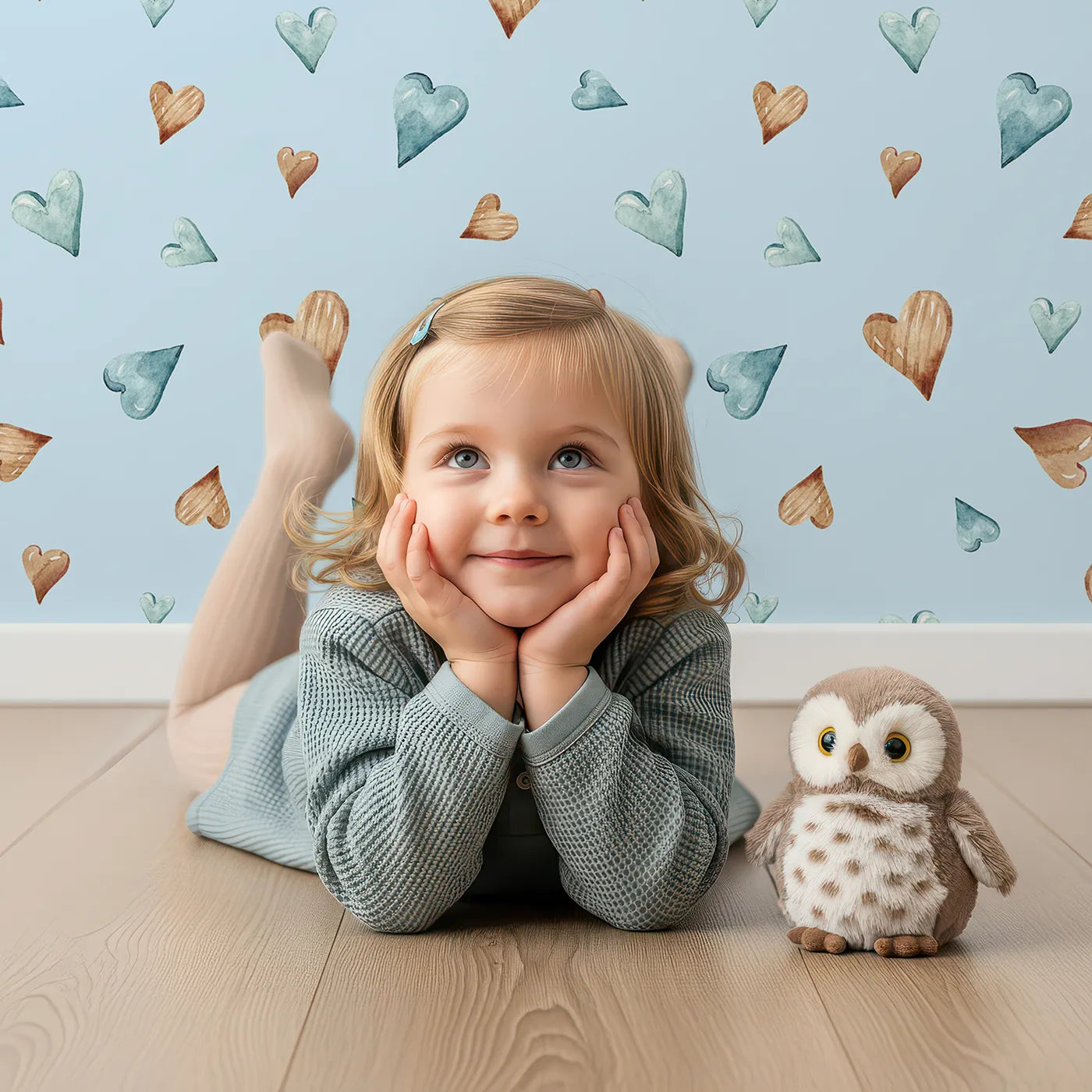 Lovely child standing in front of Whimsy Tots Heartful Whimsy Wallpaper in Sky with heart in design.
