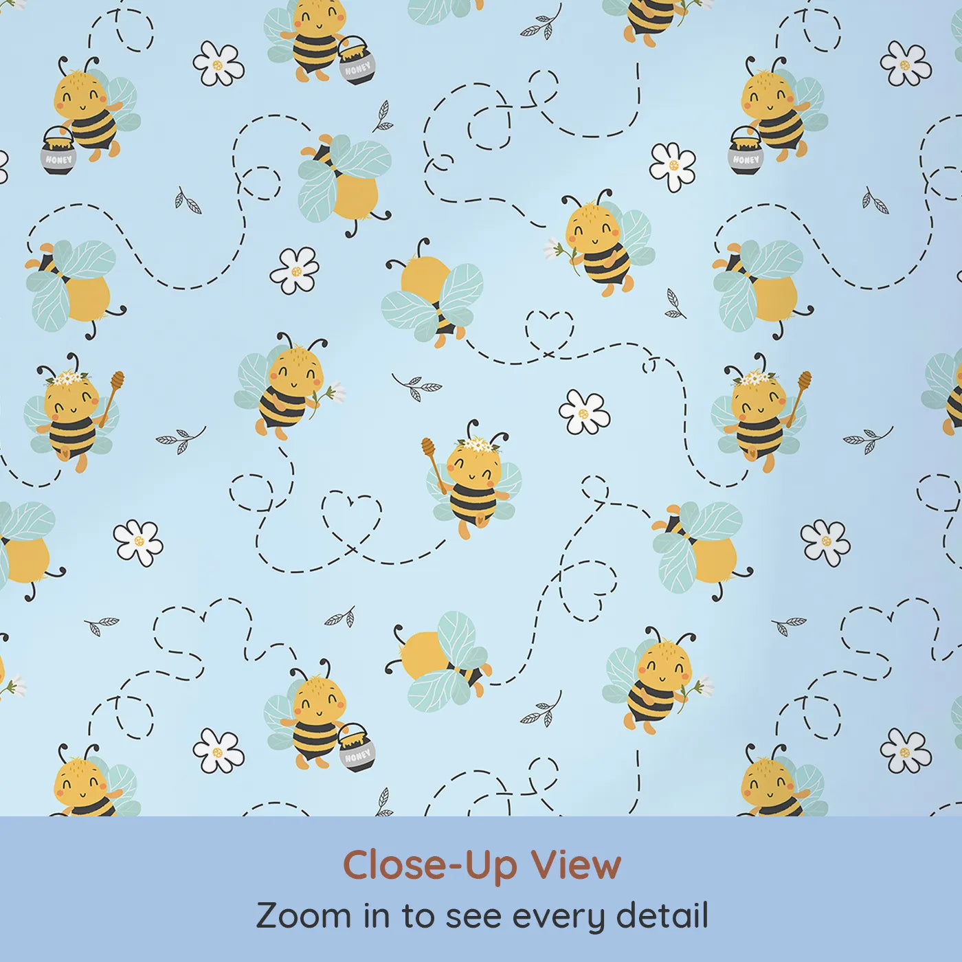 Close-up view of Whimsy Tots' Busy Bees at Play Wallpaper in Sky (W3434E).Happy bees zoom across a soft blue sky, leaving hearts and flowers in their wake.